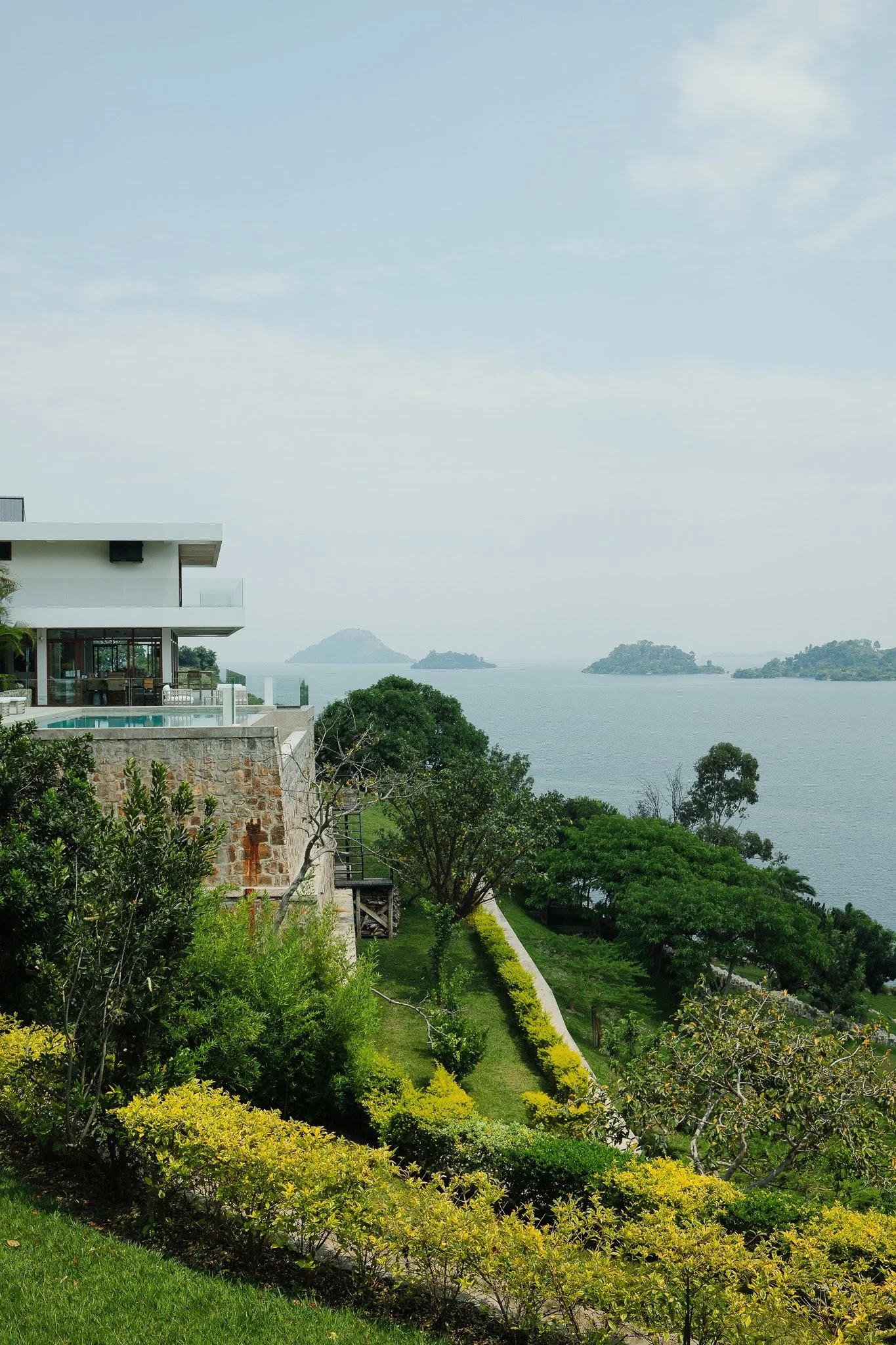 Lake Kivu: one of Africa&rsquo;s great lakes, home to peaceful shores, gentle breezes, and unforgettable sunsets. A place where time slows down... and so do you. 🌊💙

 #boutiquehotel #slowtravel #visitrwanda #volcanoesnationalpark #luxuryhotel #east