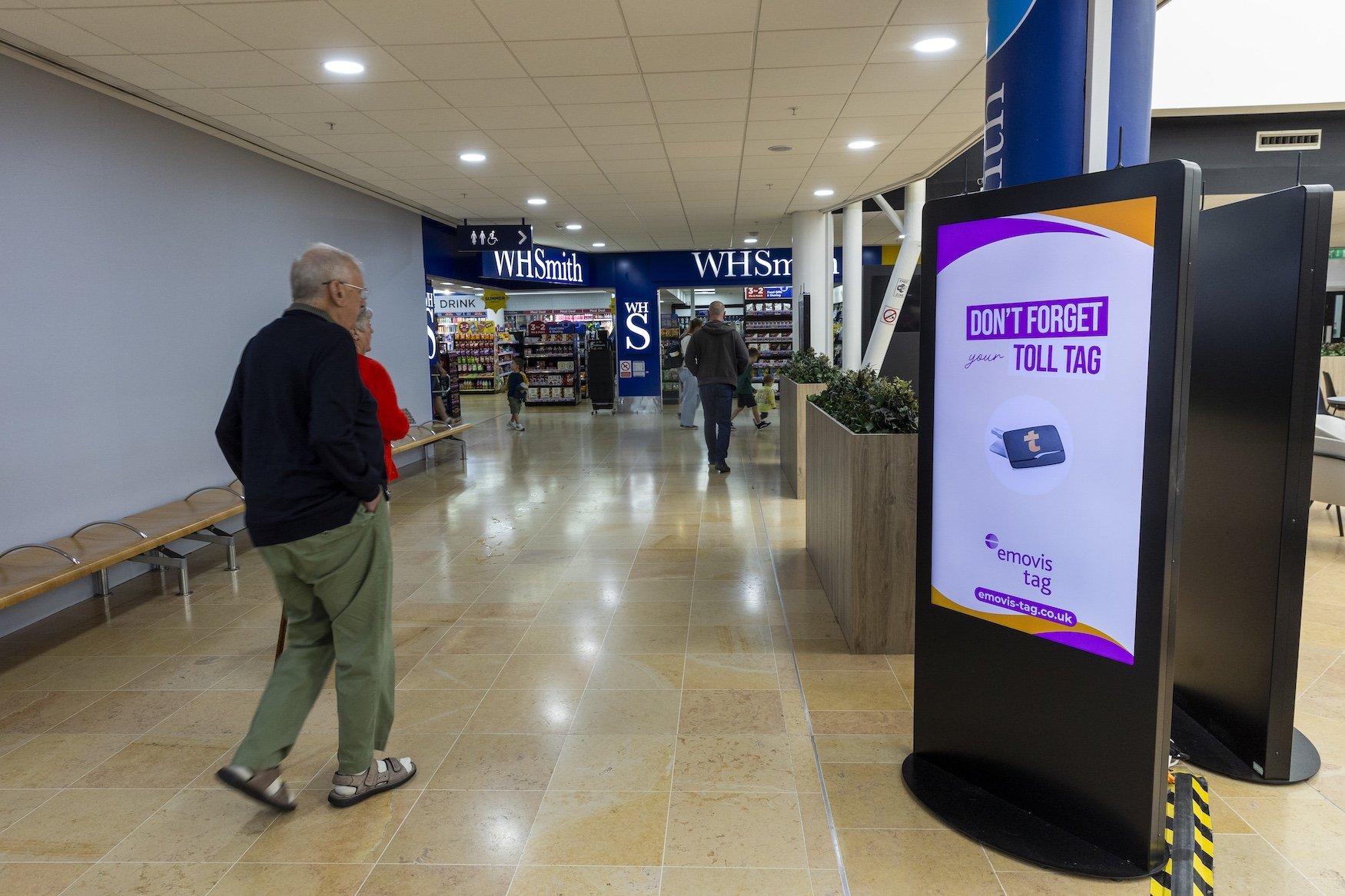 Older couple walking past Emovis D6.jpg