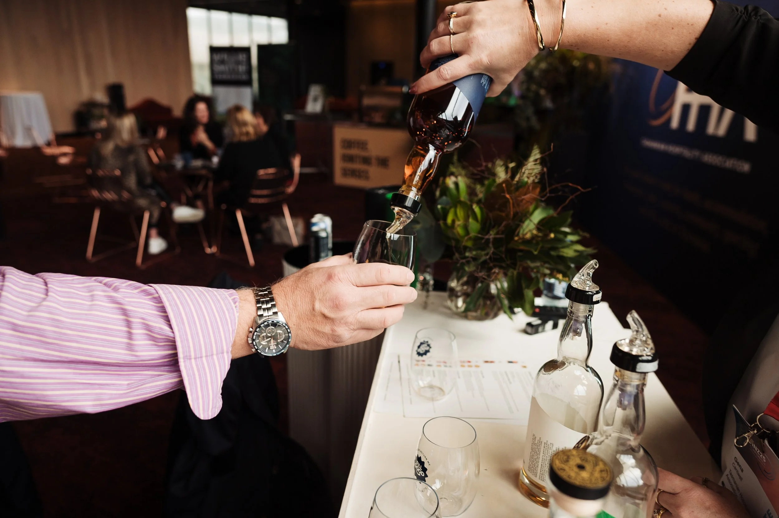 whiskey pouring into a FillGood stemless tumbler.JPG