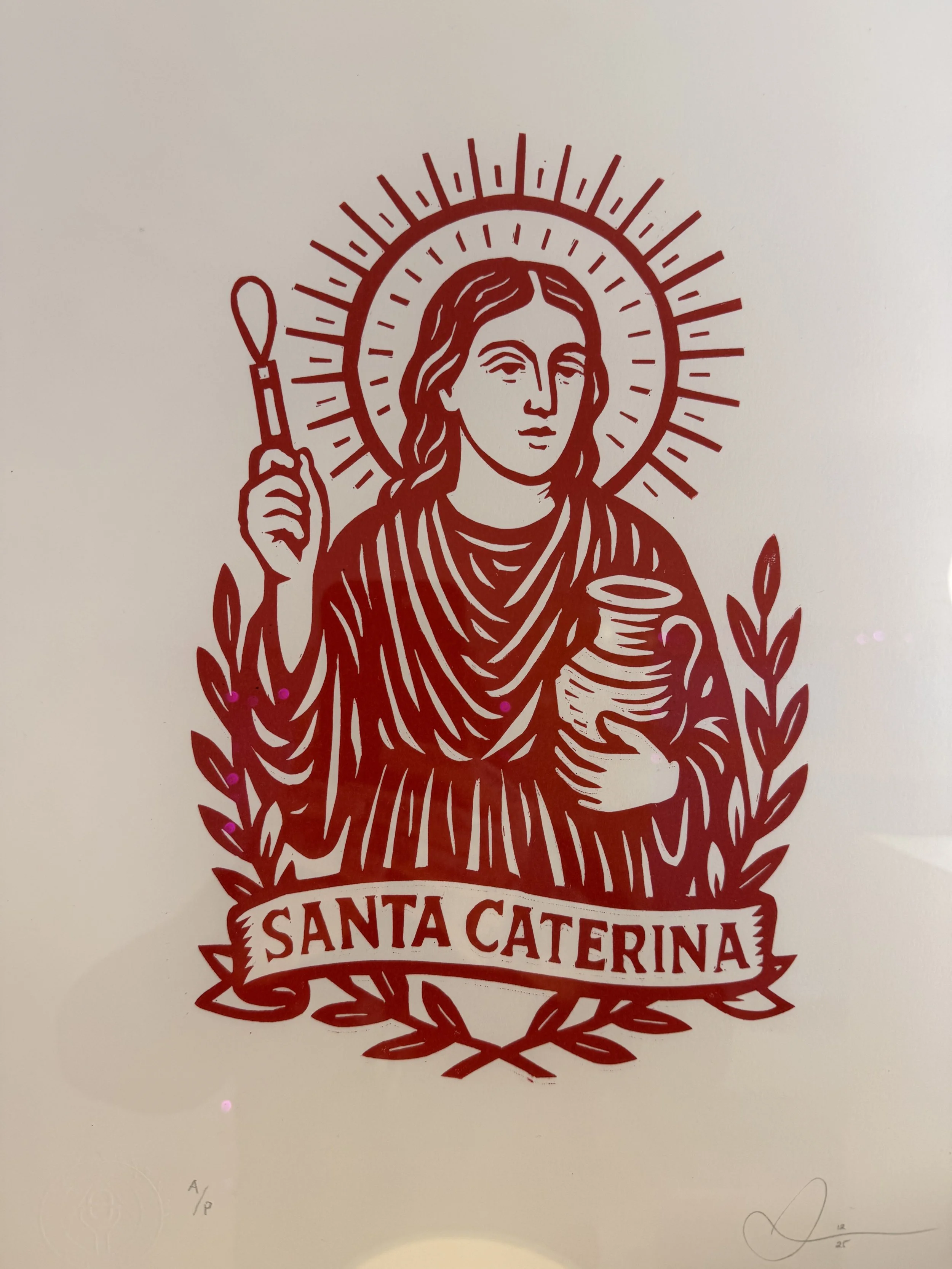 Hand-carved and hand-printed linocut of Santa Caterina, reimagined as a contemporary patron saint of ceramicists and potters. Limited small edition on archival paper.