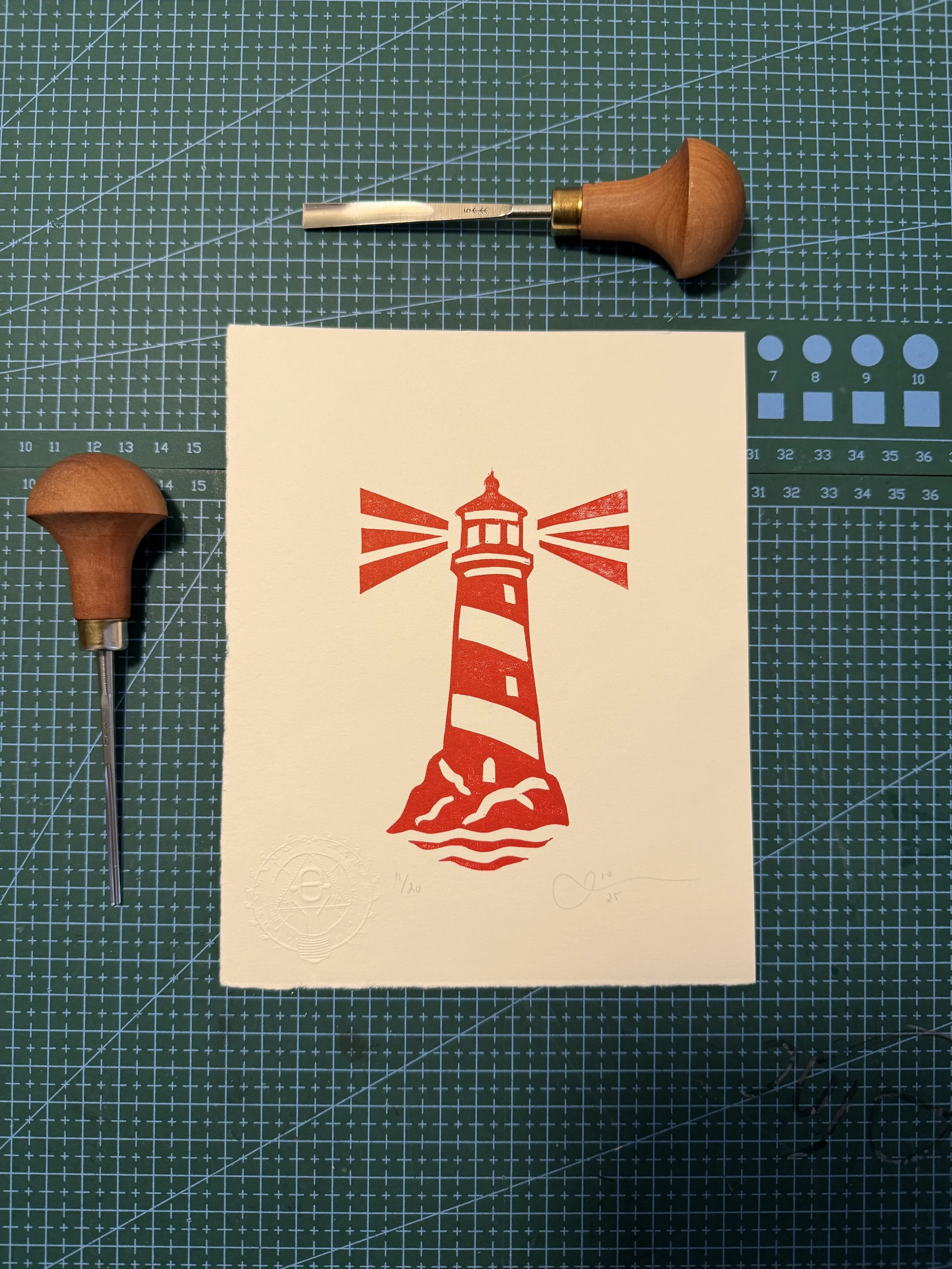 Limited-edition red lighthouse linocut print by Elucidation Inc. Hand-carved, hand-printed with Caligo Safe Wash ink on archival acid-free cotton paper. Edition of 20.