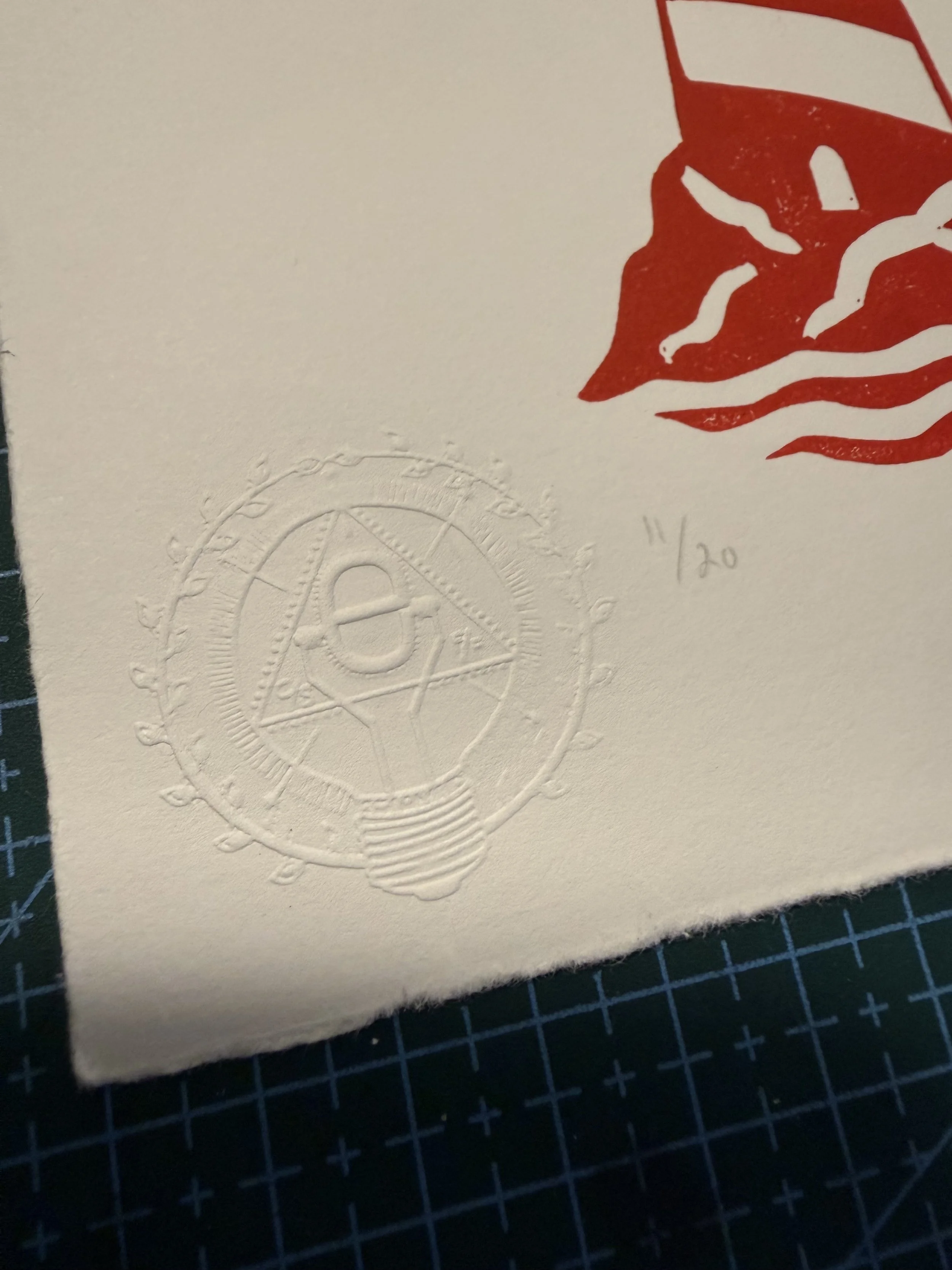 Limited-edition red lighthouse linocut print by Elucidation Inc. Hand-carved, hand-printed with Caligo Safe Wash ink on archival acid-free cotton paper. Edition of 20.