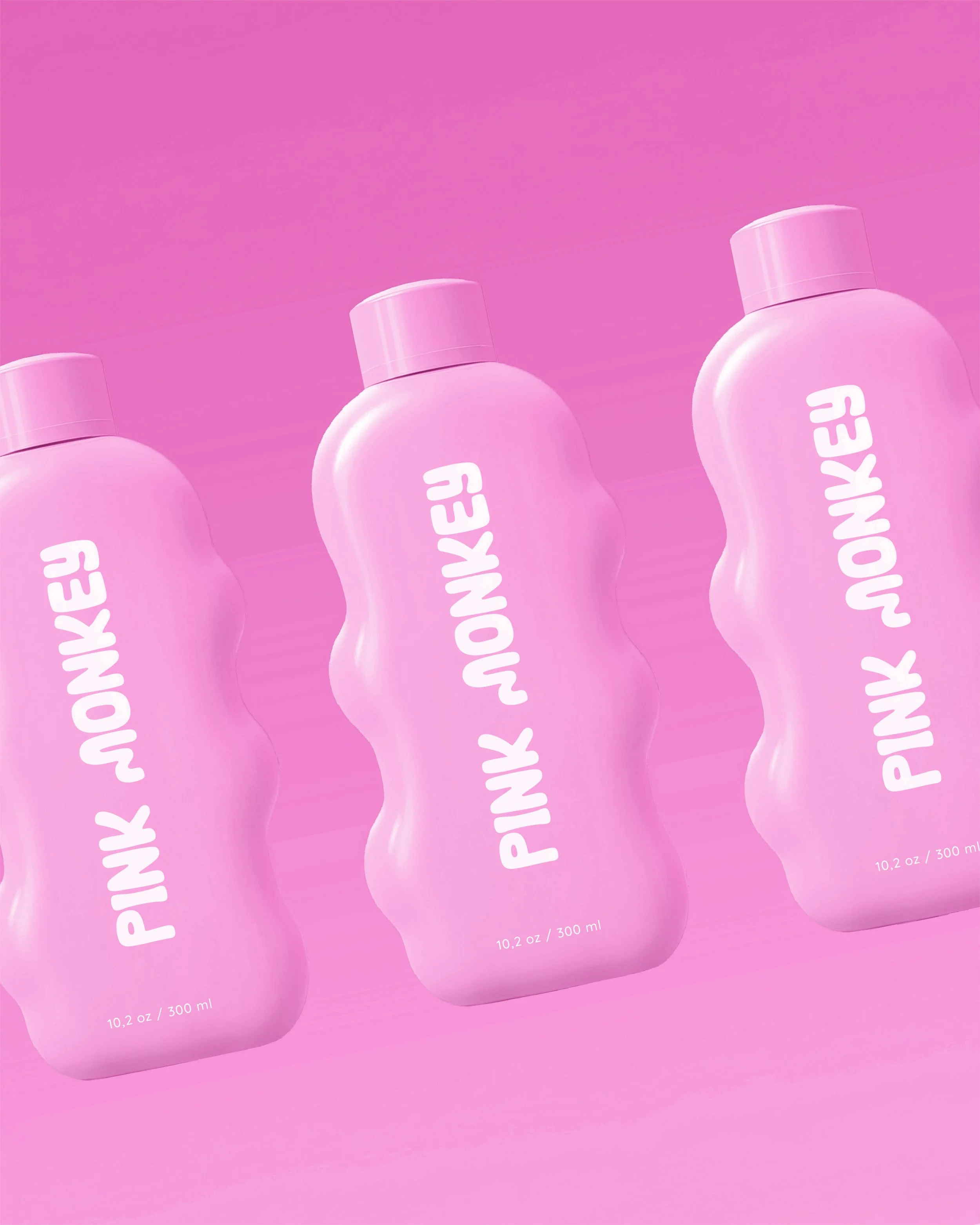 Three pink bottles labeled 'Pink Monkey' against a pink background.