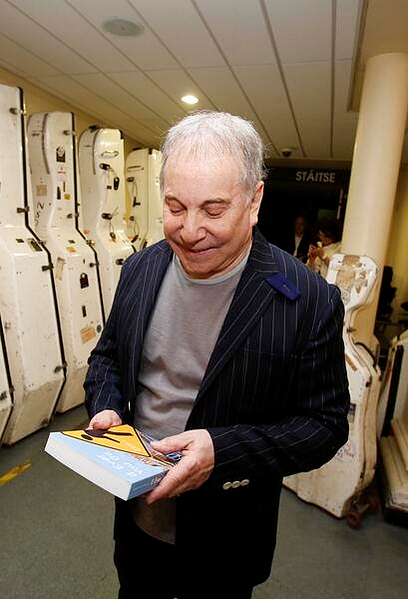 Paul Simon with his copy of "If Ever You Go", the anthology of Dublin poems and songs edited by Smyth and Pat Boran and published by Dedalus Press