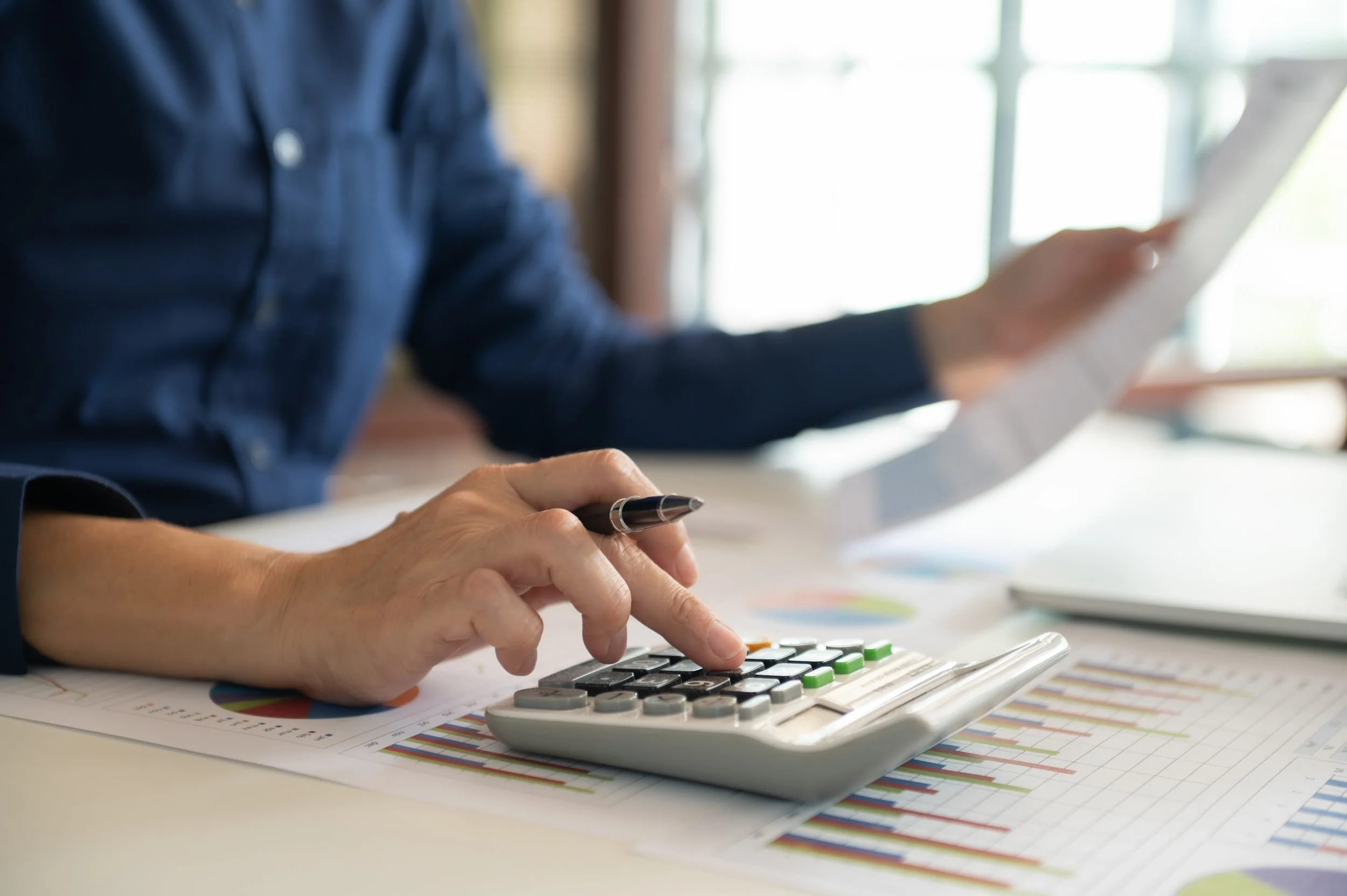 Financial planning and finance for businesses, man with calculator