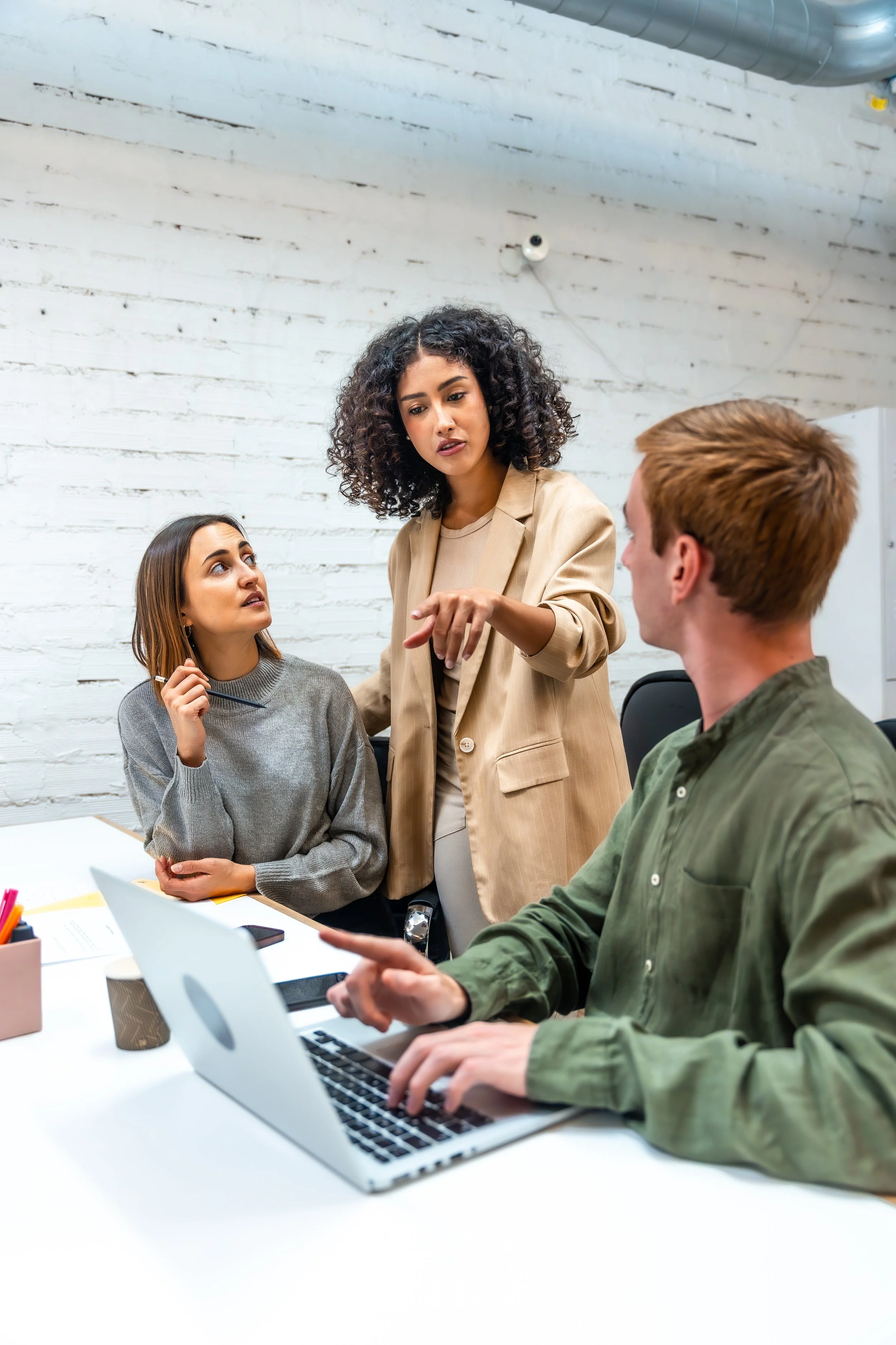 Office team together around laptop