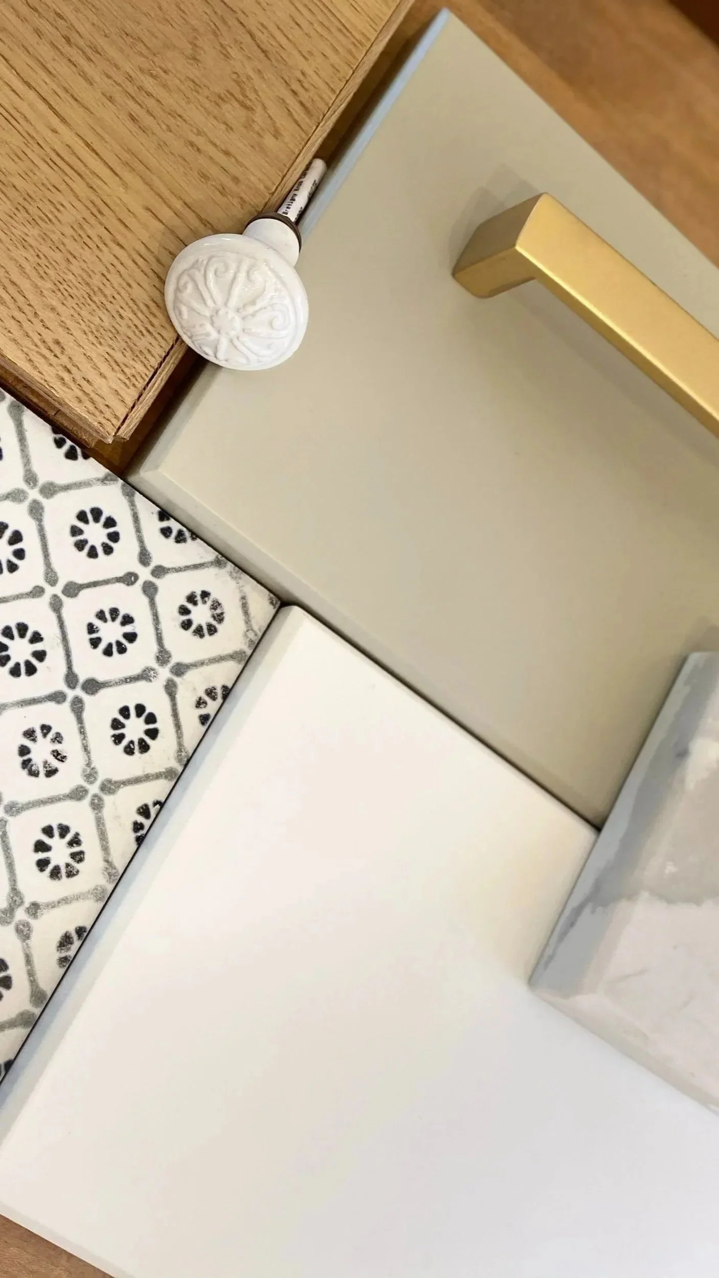 A selection of interior finishes and knobs for a custom kitchen renovation by Waterfront, a Toronto design-build firm.