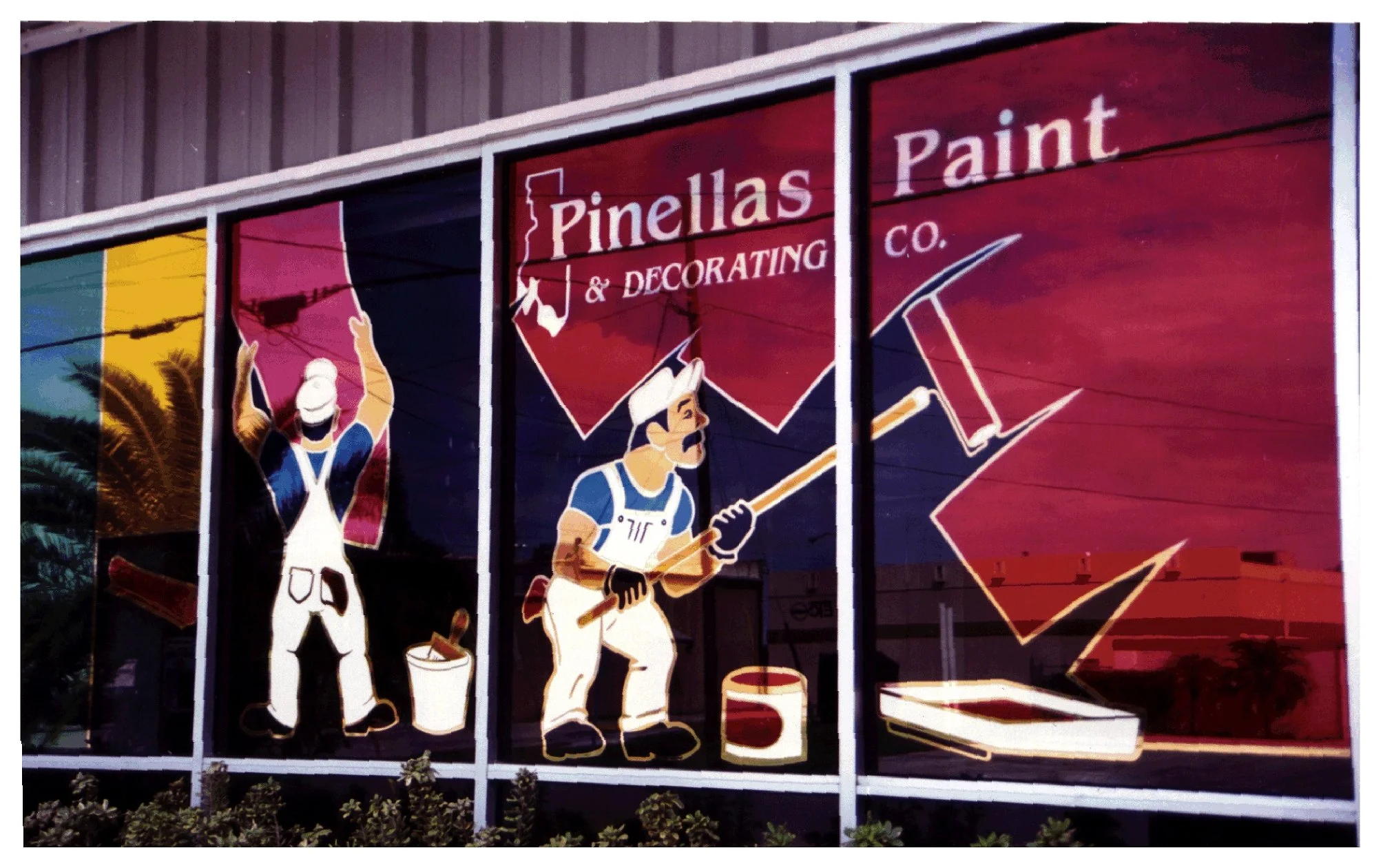 Window mural of painters for Pinellas Paint & Decorating Co. colored window film