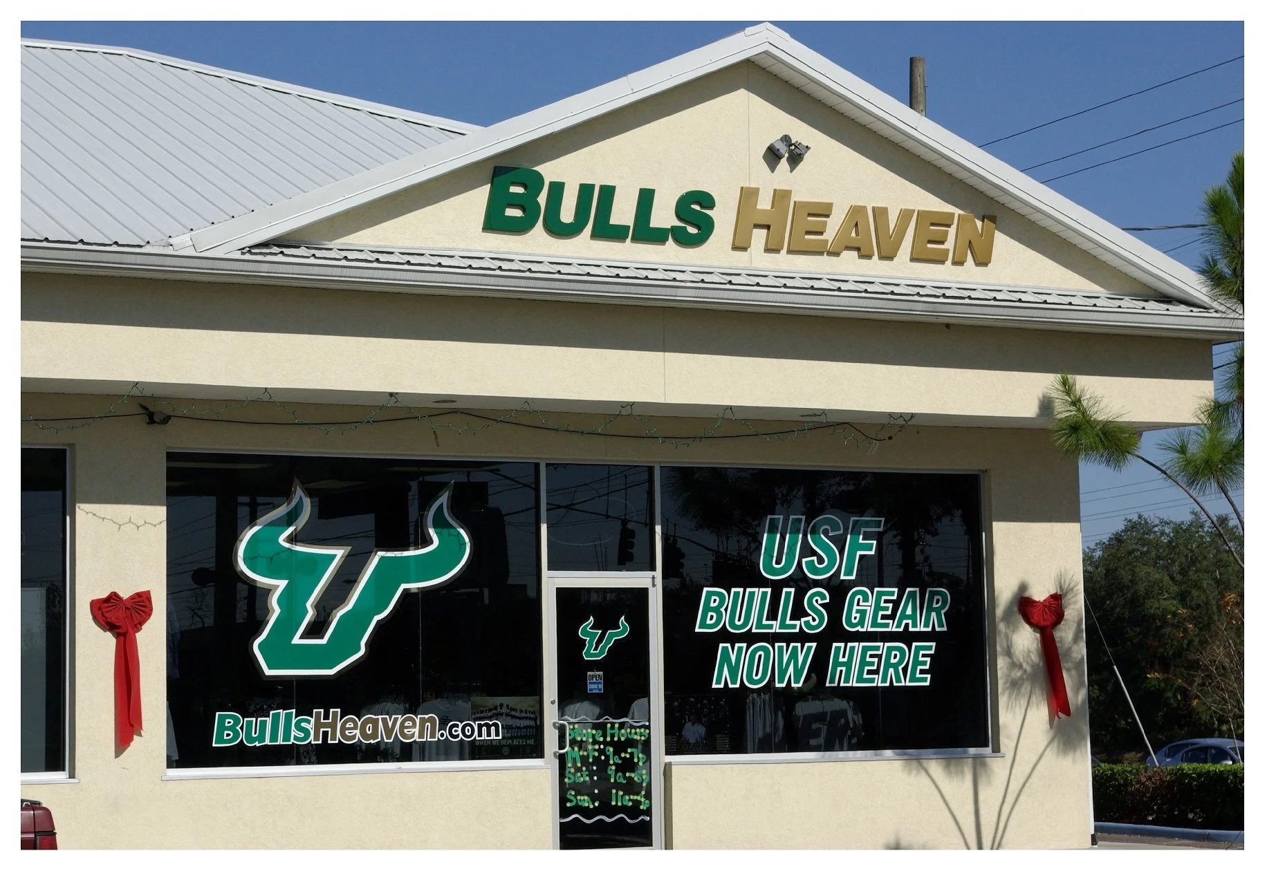Bulls Heaven store exterior with sign advertising USF Bulls gear. colored window film