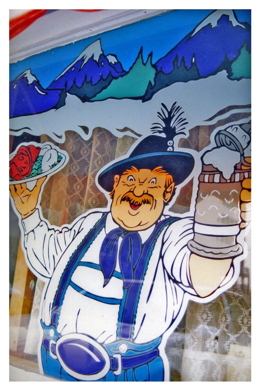 Illustration of a cheerful man in traditional Bavarian attire holding a plate of food and a large beer mug against a backdrop of snow-capped mountains.
