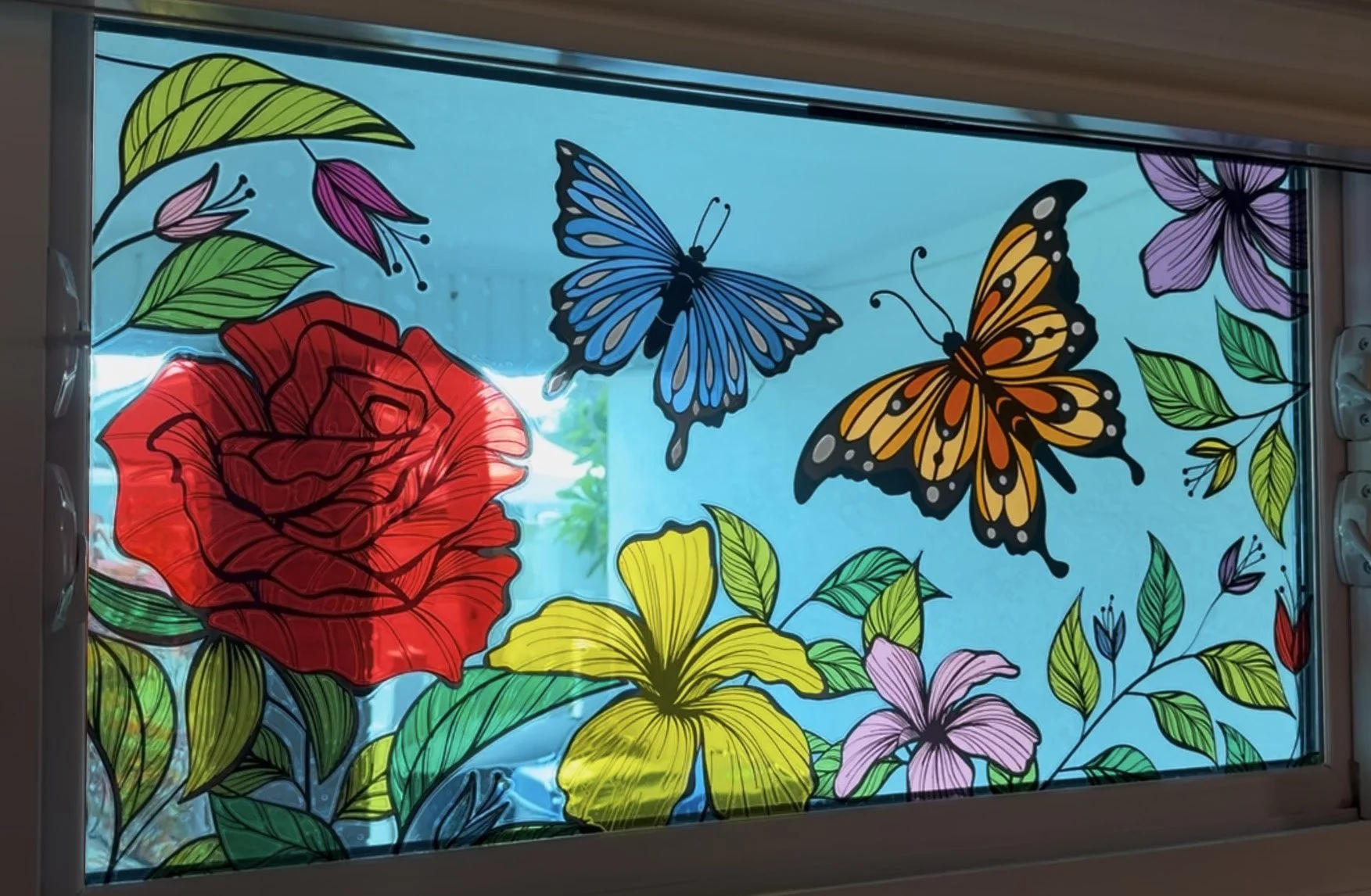 Multi-layered colored window film graphic