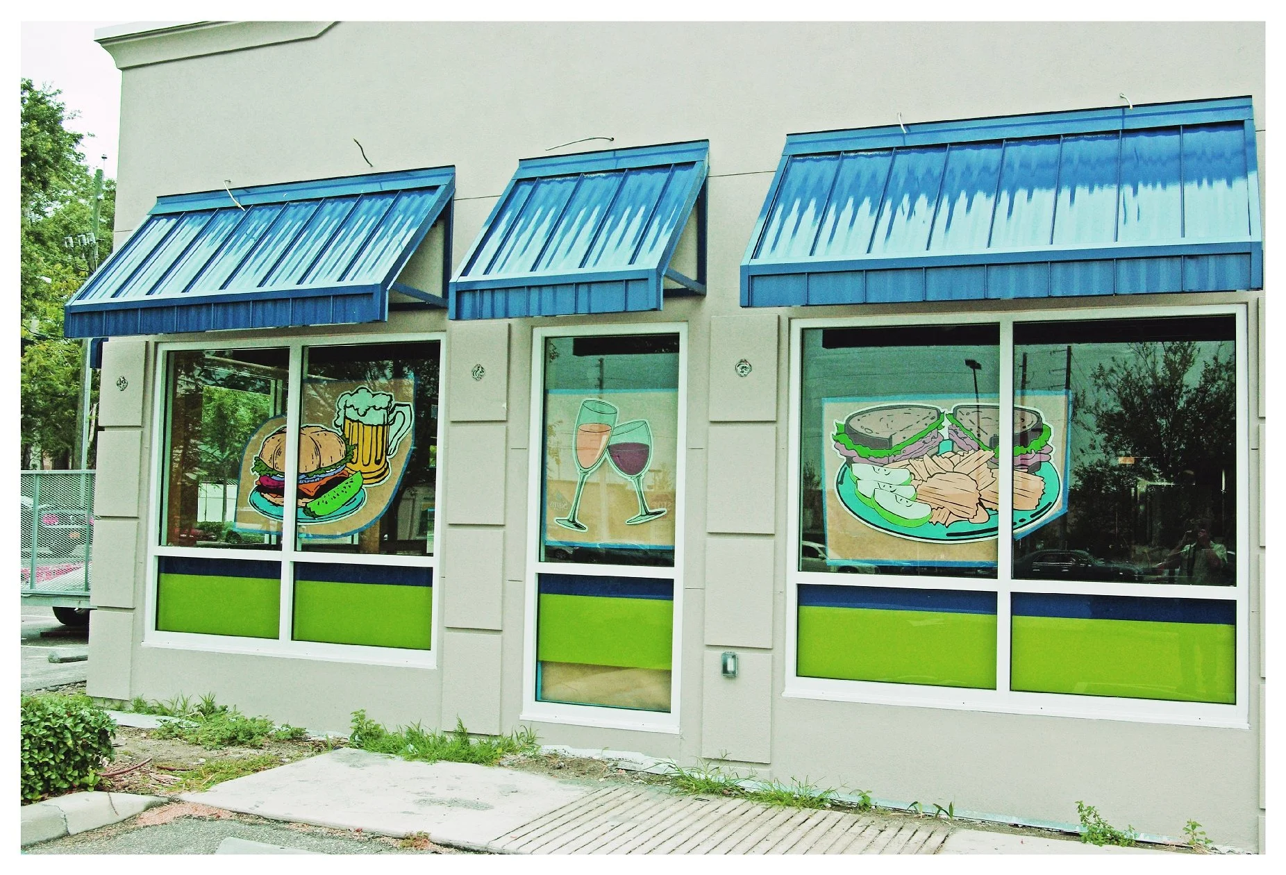 restaurant exterior with food and drink illustrations on windows colored window film