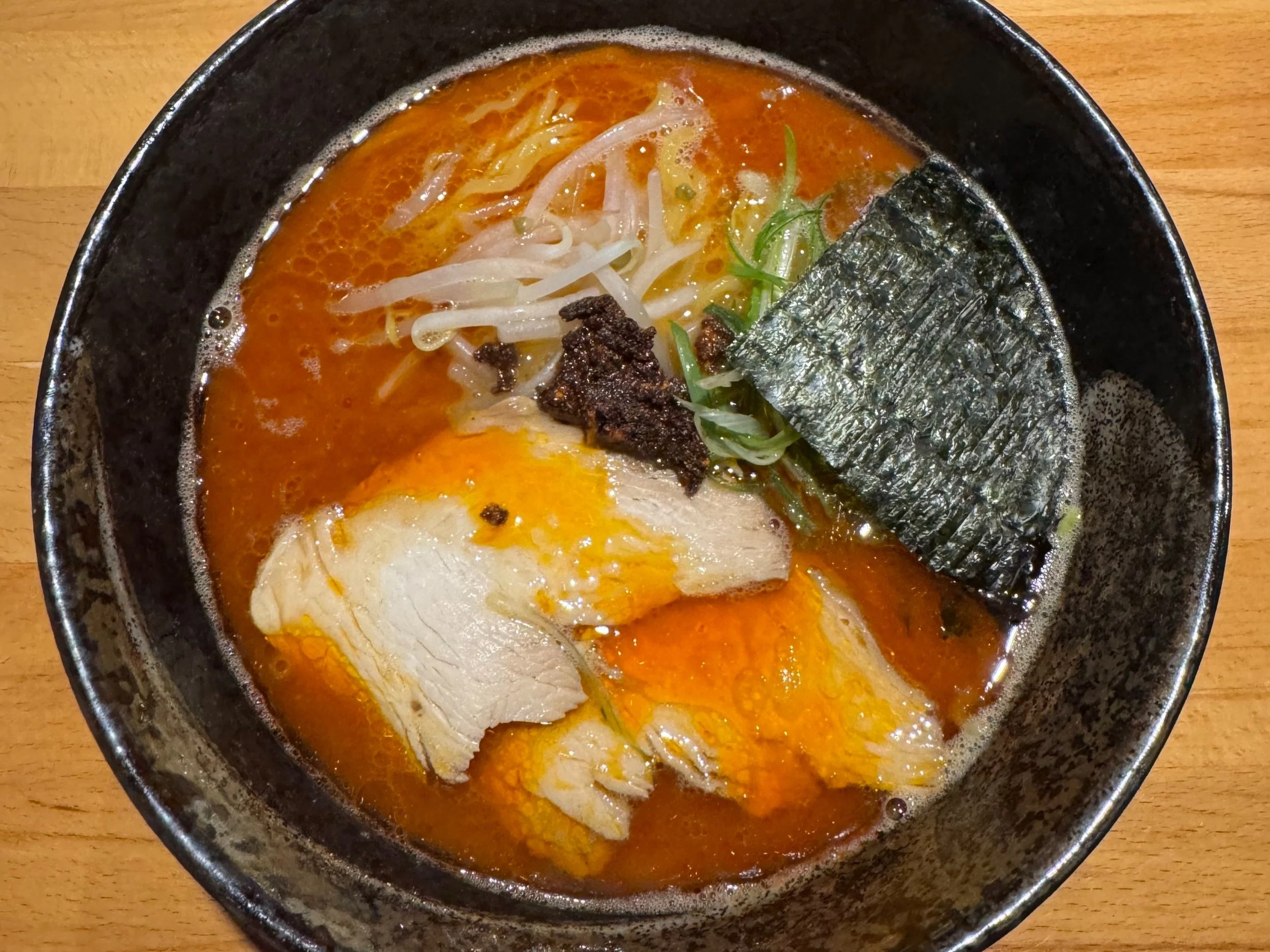 hot bowl of spicy ramen with chicken and noodles