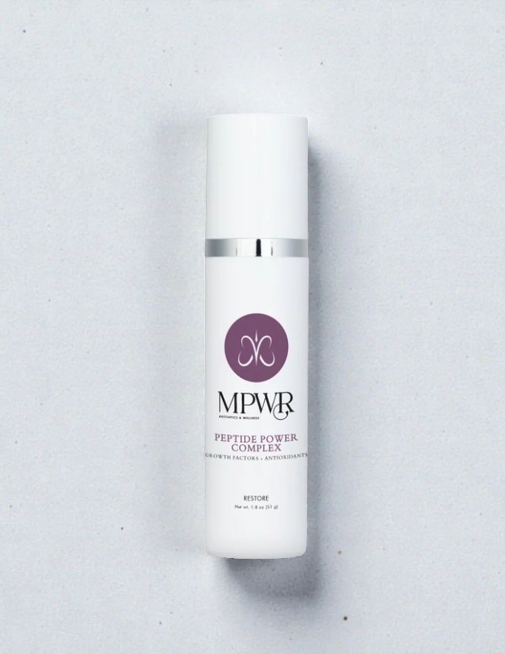 White cosmetic bottle labeled 'MPWR Peptide Power Complex.'