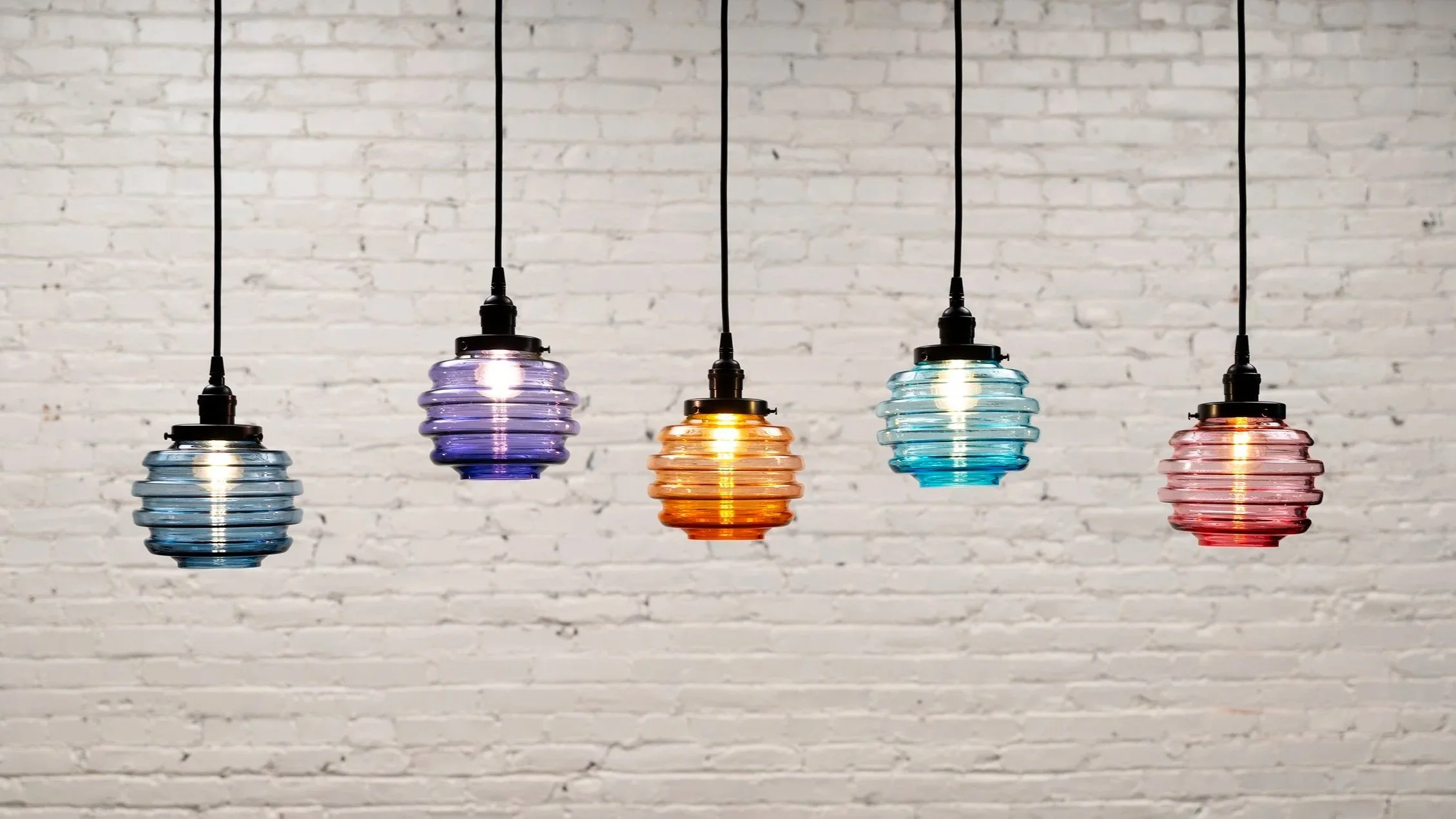 Honey Pendant Lights hanging with various color glass shades