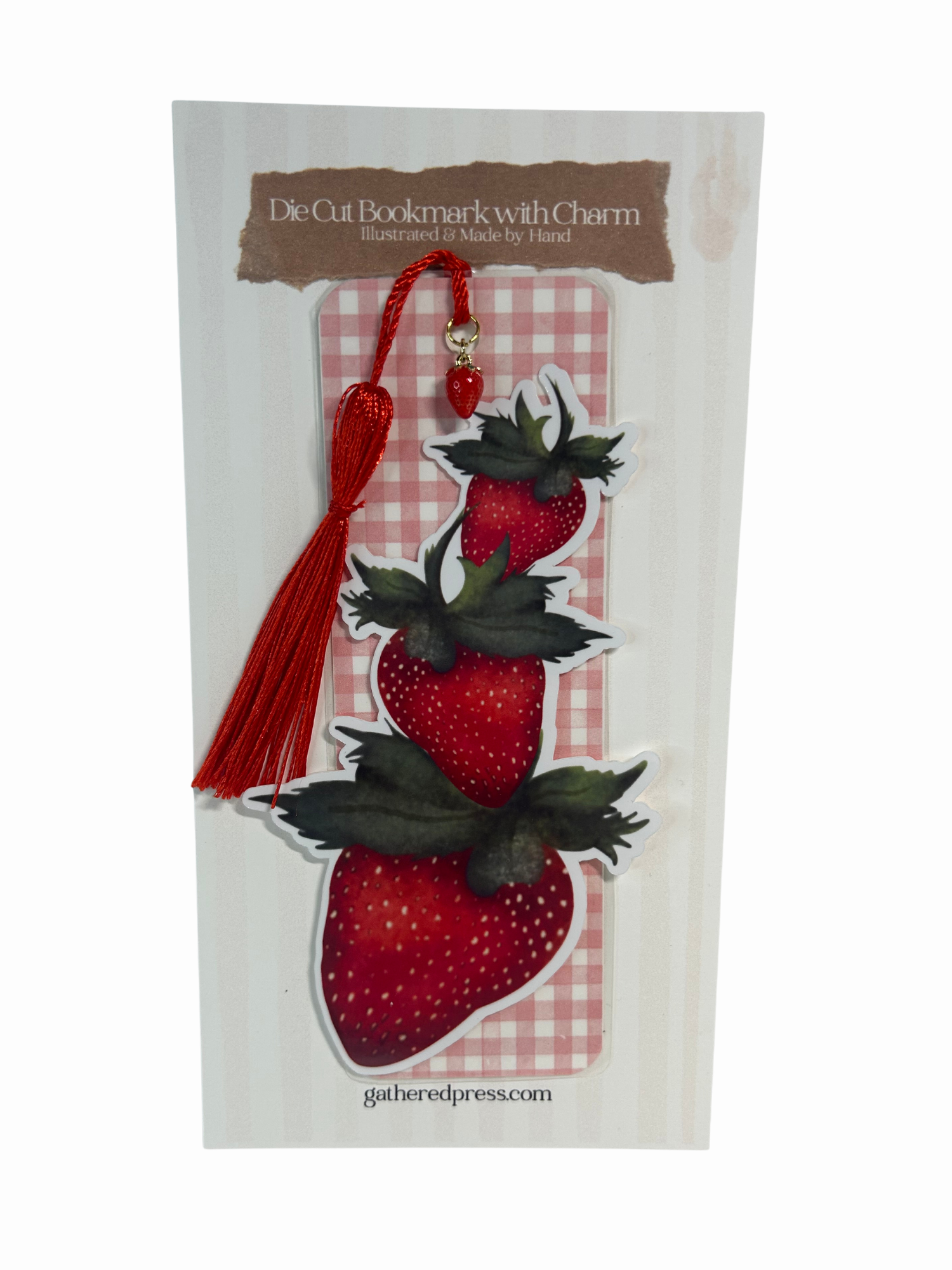 Handcrafted strawberry die-cut bookmark featuring three hand-illustrated strawberries, red tassel and small strawberry charm.