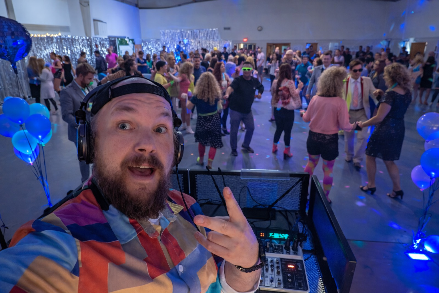 Why Your Company Party Needs a DJ (Not Just a Playlist)