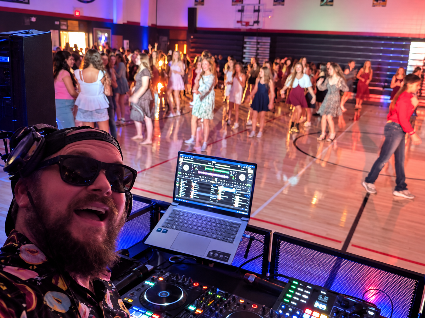 DJ Booth at a Vibrant School Dance.png