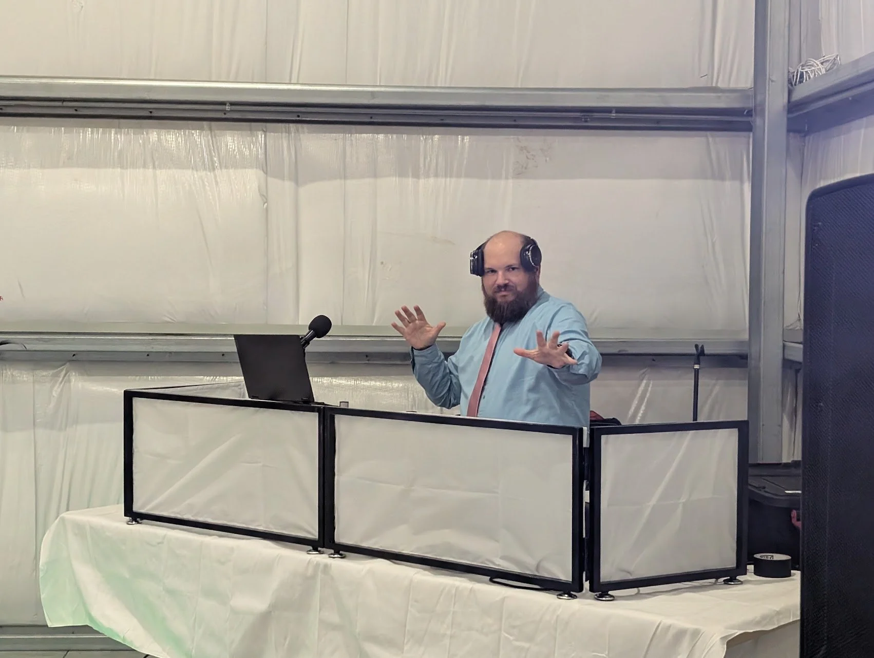 “Minimalist white DJ booth setup at a formal event venue in Columbia, MO.”