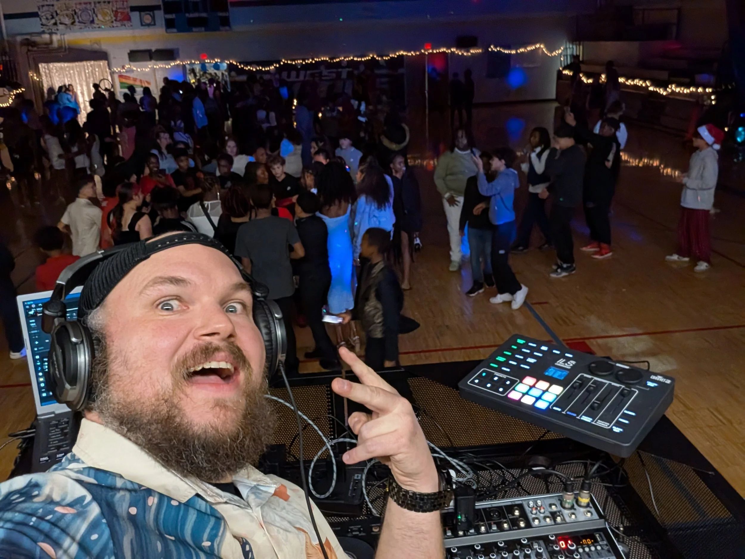 DJ Jazzy Josh bringing the beats and energy to a school school dance floor