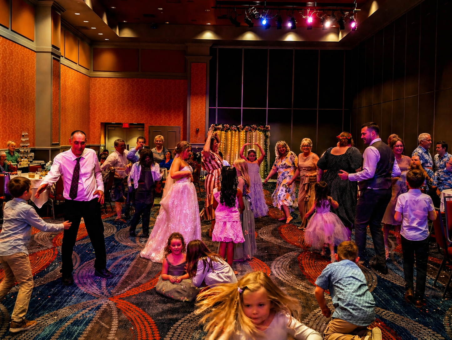 Packed wedding dance floor with kids and adults dancing together during a high-energy reception hosted by Jazzy Josh DJ & Events