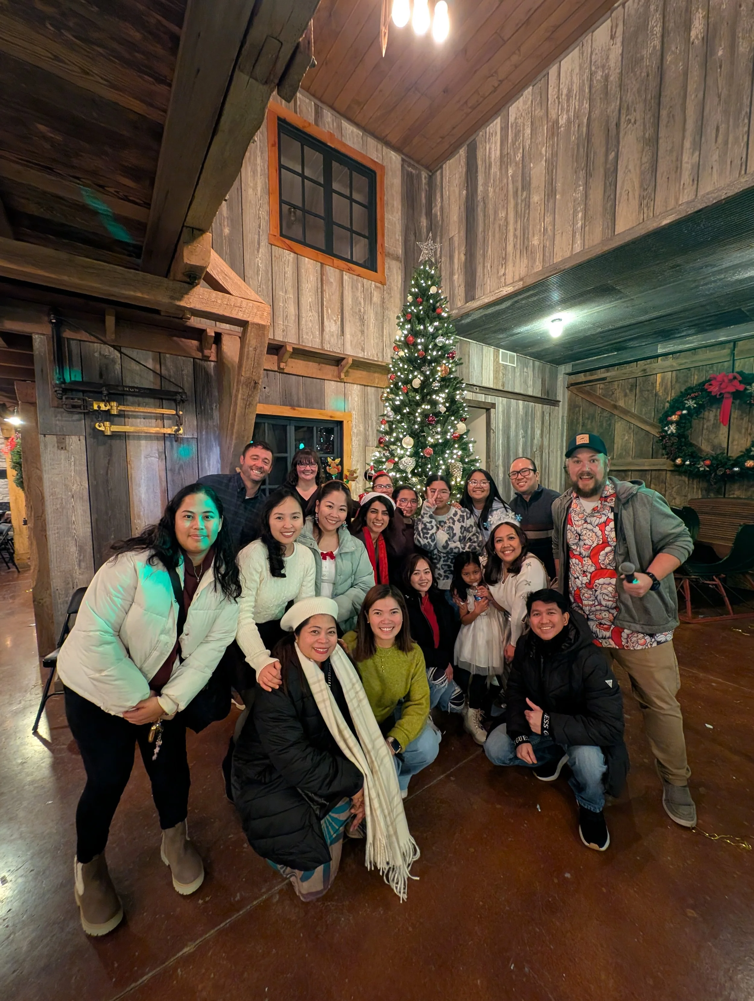 DJ Jazzy Josh jumping into a photo up with some satisfied Christmas Party customers