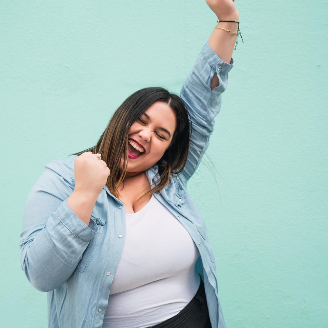 Woman making a strong victorious pose