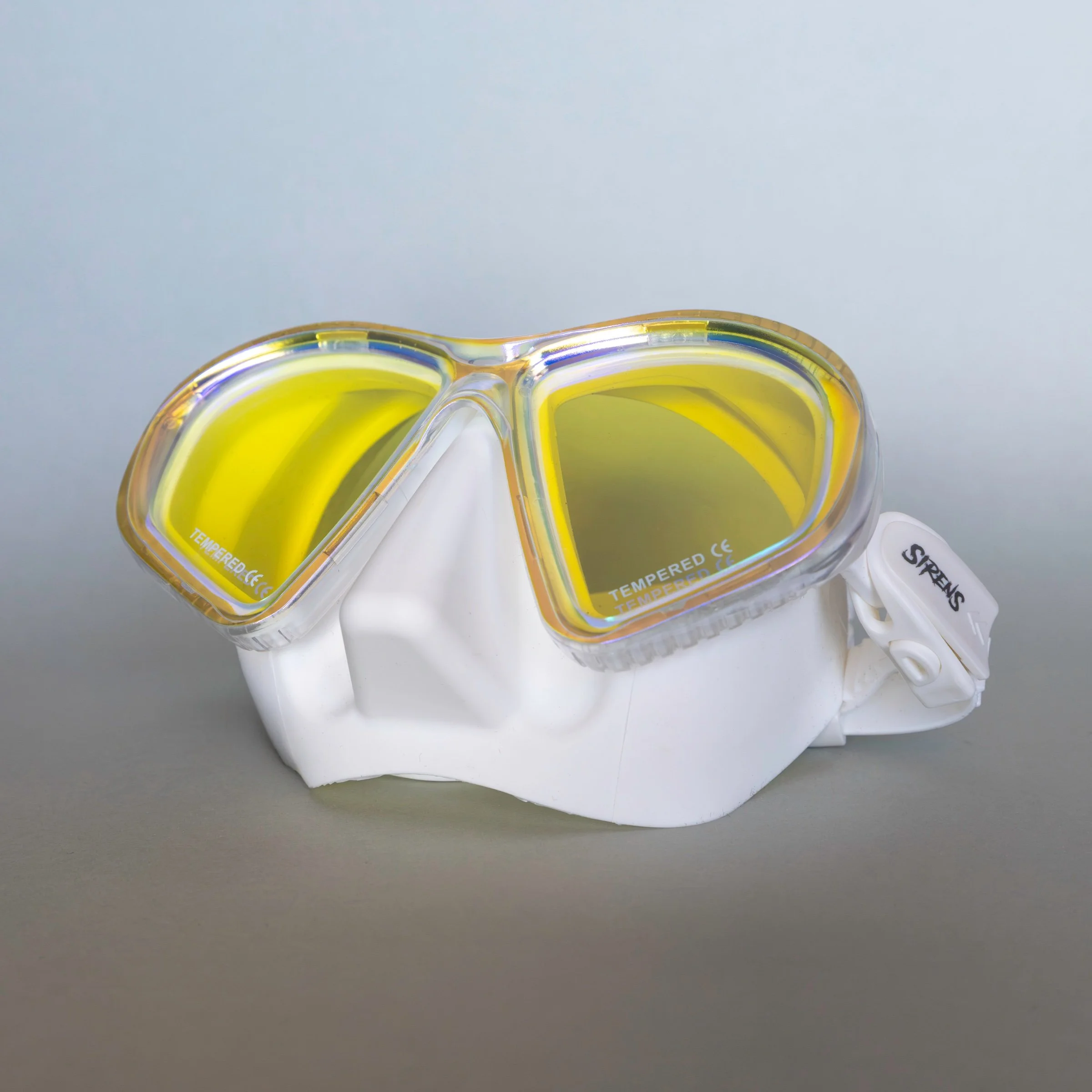 Pink Pearl Sirens dive mask with a pale pink and white finish on a neutral background.