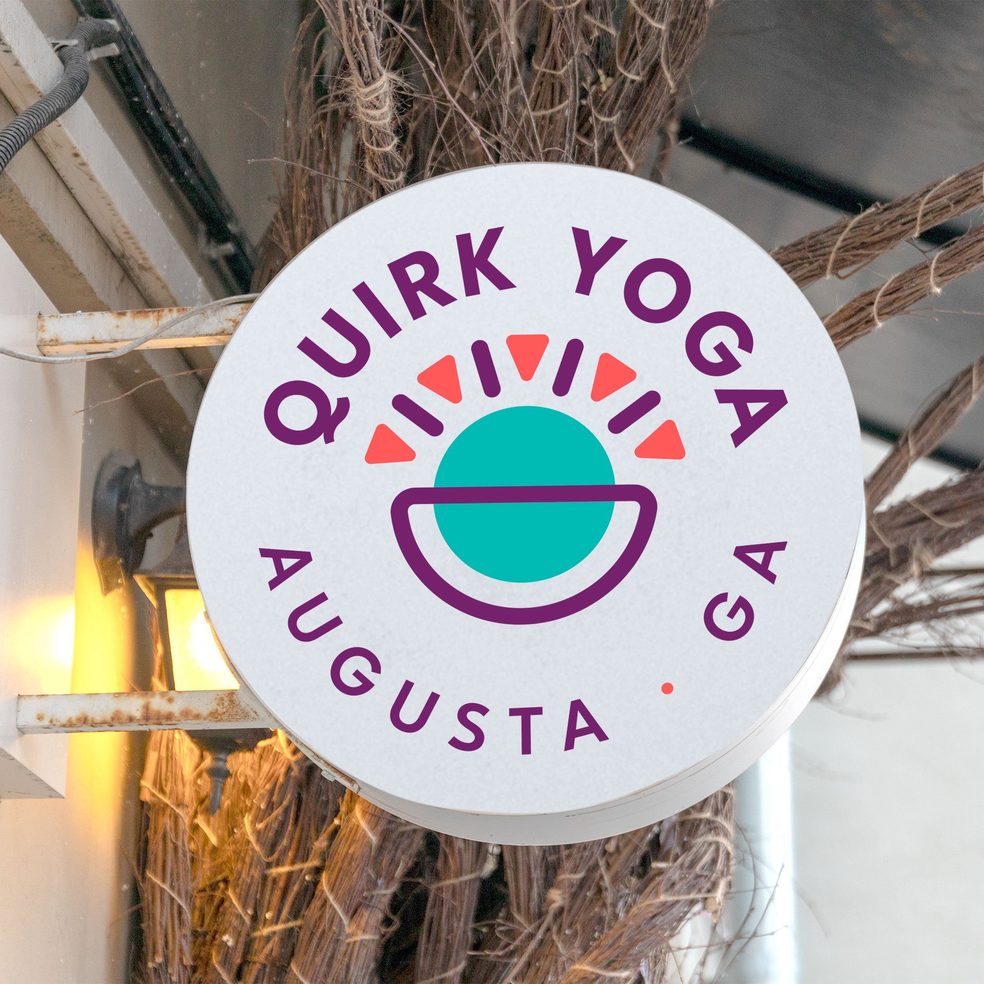 Yoga Studio brand logo design on an outdoor sign