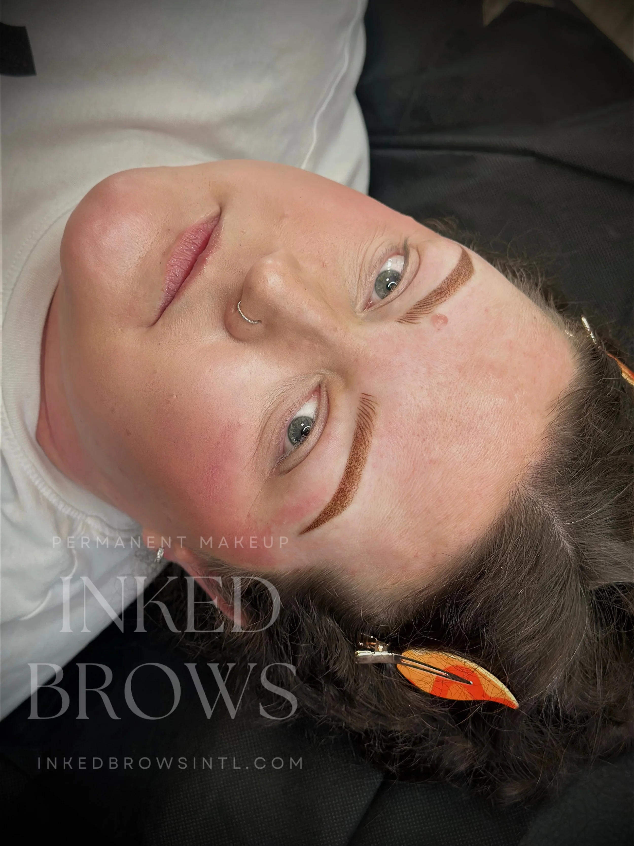 Close-up of a woman's face with newly applied permanent makeup on eyebrows.
Nano Fusion done by Inked Brows International a Permanent Makeup Studio located in Martinsburg, WV.
