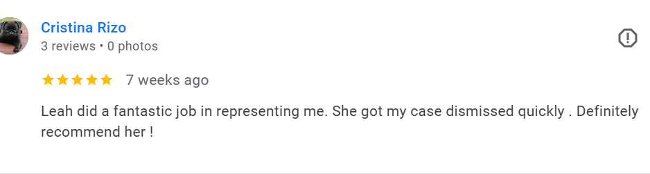 Screenshot of a Google review by Cristina Rizo praising Leah for her help in dismissing a case, with a five-star rating.