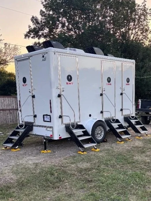 DFW King Service 4-station restroom trailer with four doors and fold-out stairs