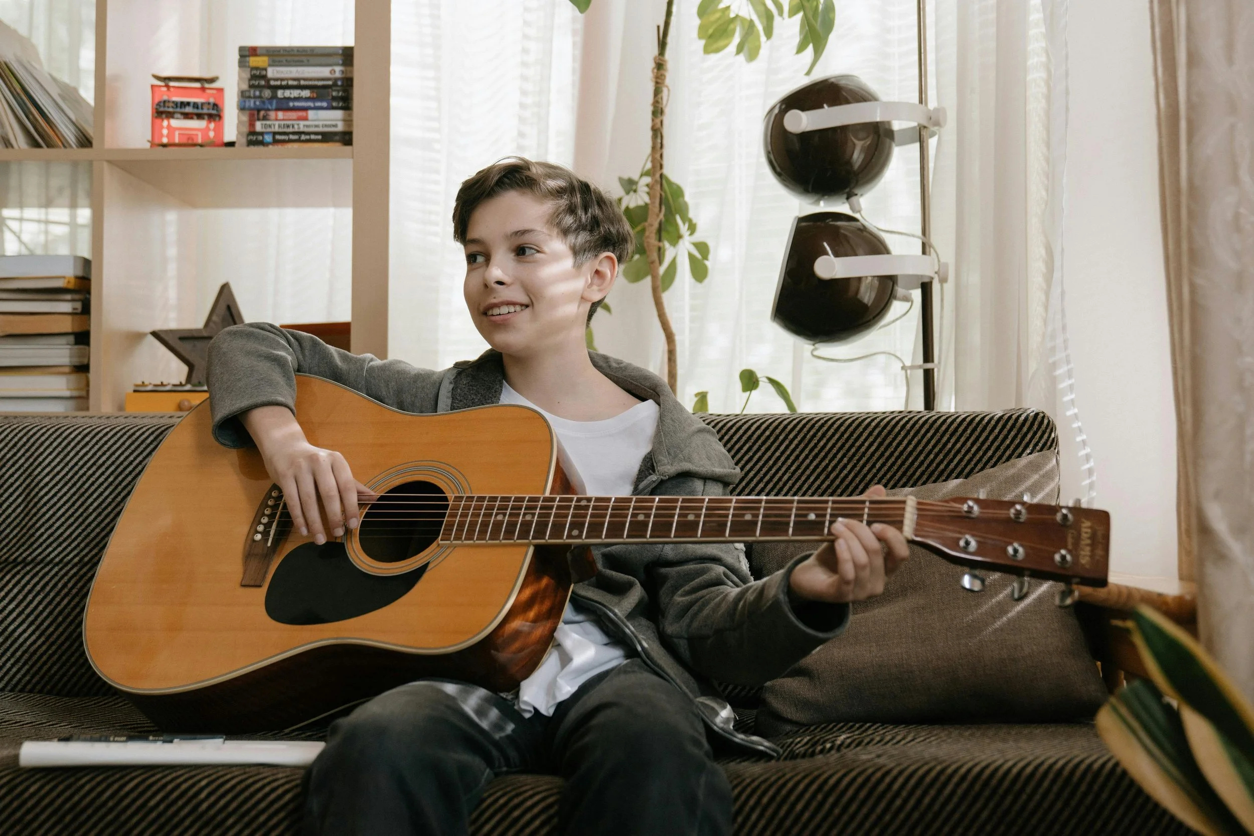 Student playing guitar