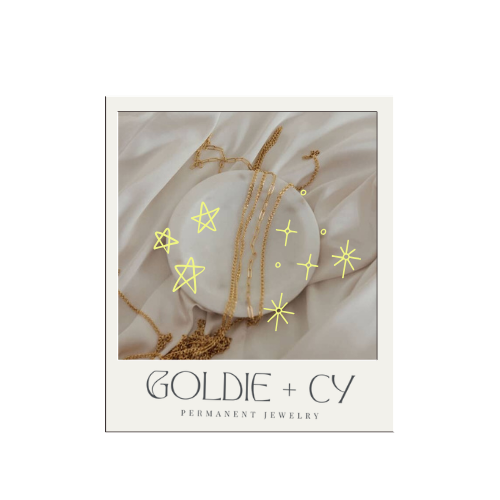 Gold jewelry displayed on a white fabric background with yellow star and sparkle doodles, branded as Goldic + CY permanent jewelry.