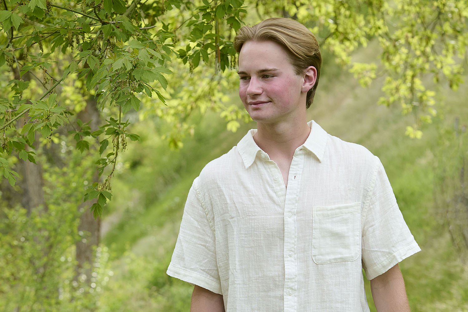 Kirsten Hepburn Photography senior class portrait of a teen in spring greenery in Salt Lake City Utah