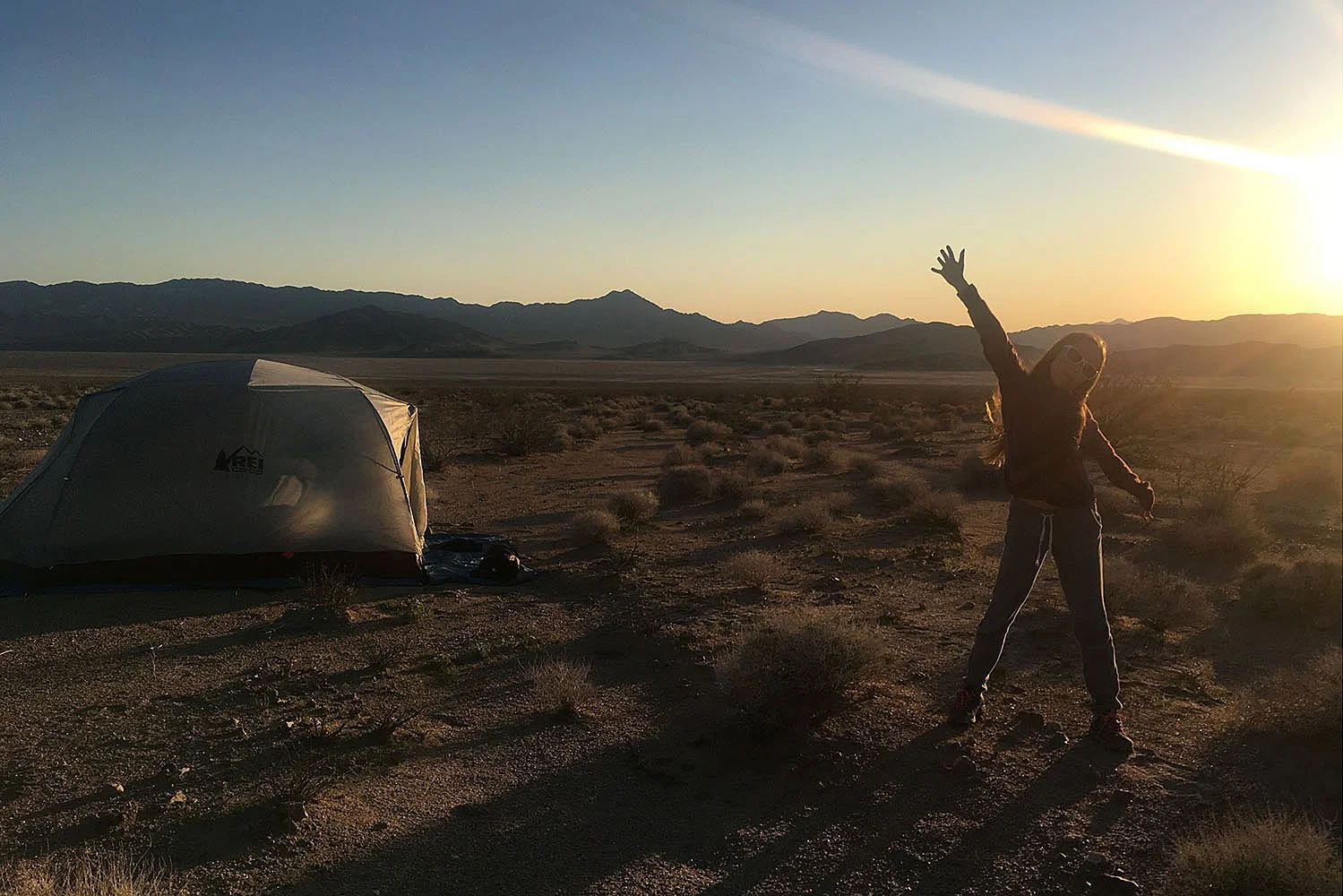 Kirsten Hepburn Photography portrait of a girl at sunset in the desert with tent