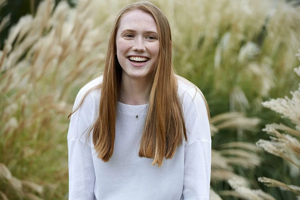 19 senior portrait laughing in grasses.jpg