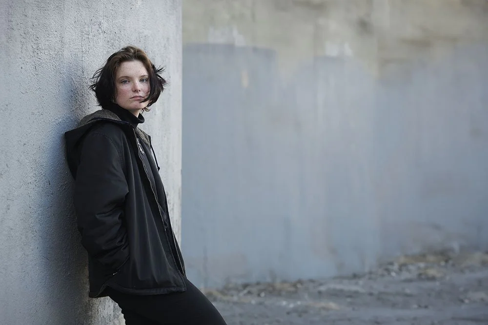 senior portrait of teen in gritty urban scene