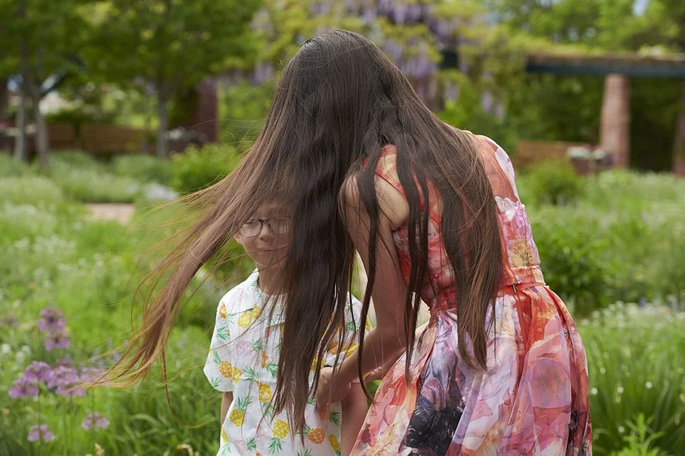 Kirsten Hepburn Photography portrait of a mother with long hair in the wind