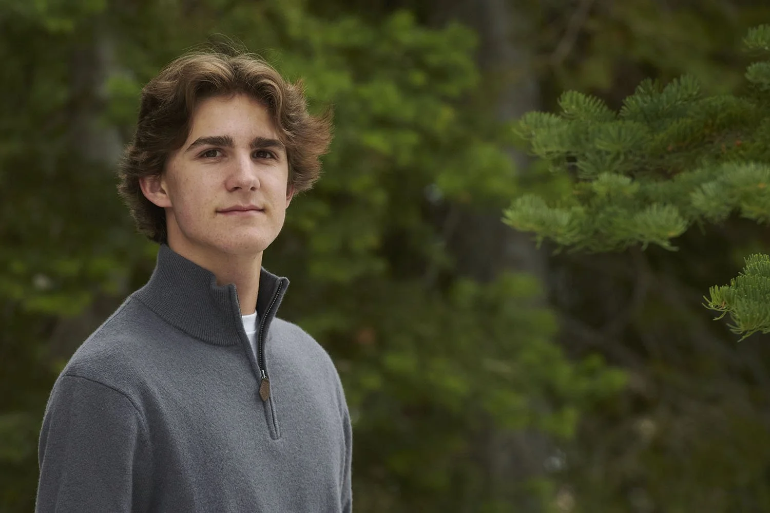 41 senior portrait boy in woods.jpg