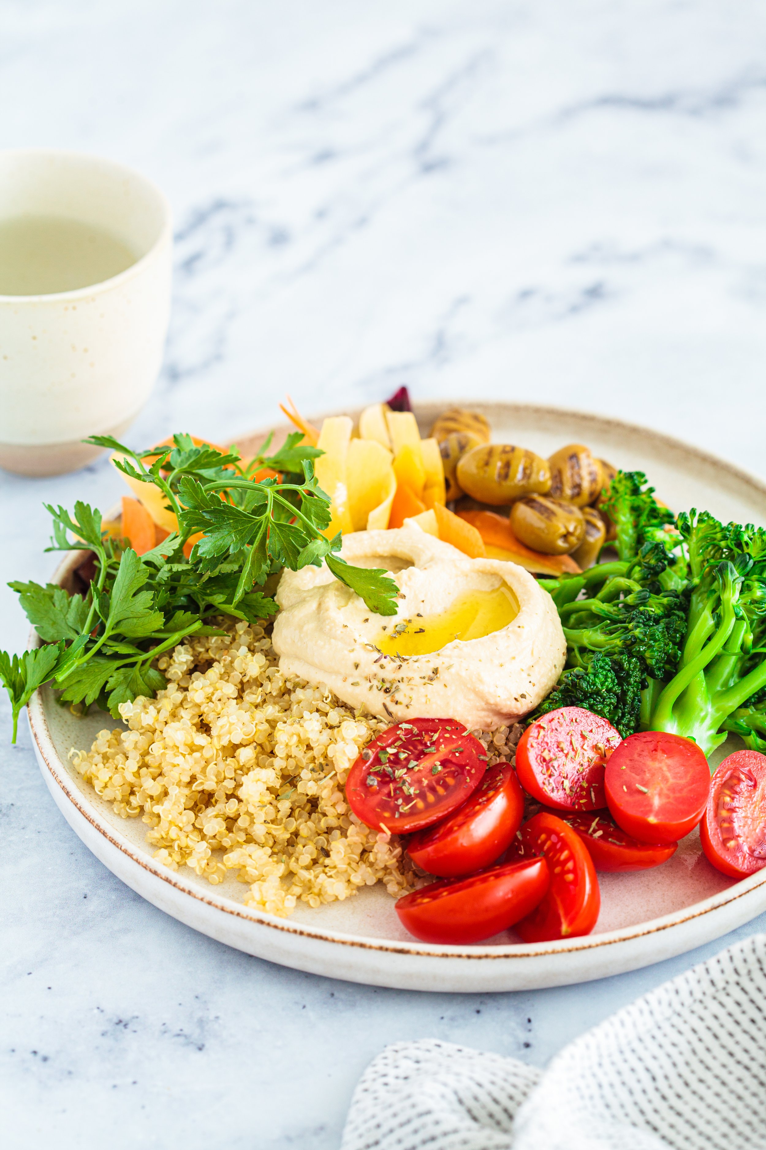 balanced-quinoa-salad-with-broccoli-hummus-olive-2023-11-27-05-29-54-utc.jpg