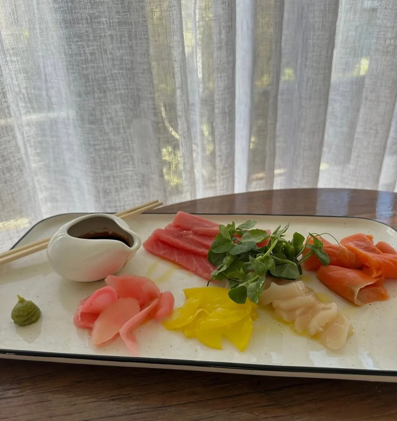 Try our Sashimi Tasting Plate for Two 
~ Yellowfin tuna, Atlantic salmon, Hokkaido scallops, pickled radish, ginger, wasabi and house made dressing.