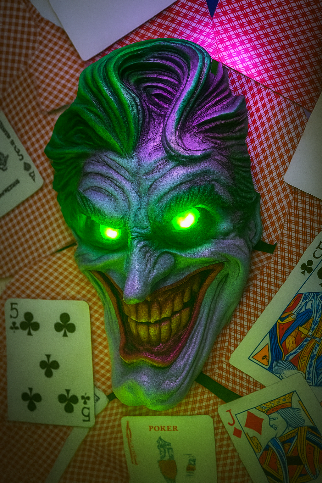 20250707_1543_Illuminated Joker Mask_remix_01jzj0shw4fkt8gdqtr3sy5s66.png