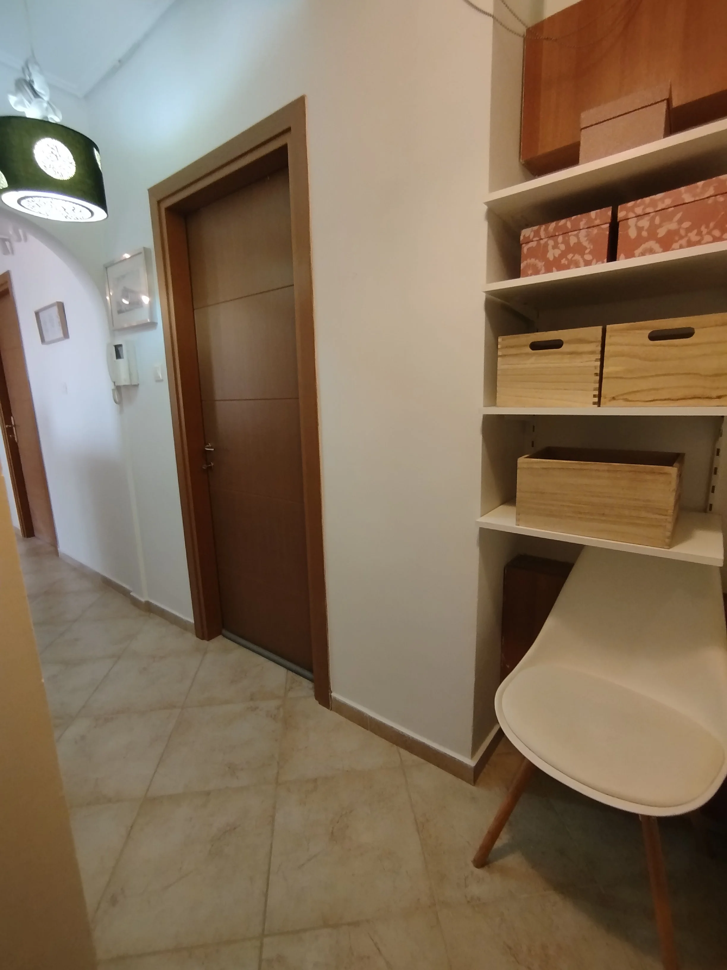 Elegant fully furnished living room with modern decor and sea view windows in Salamina apartment.