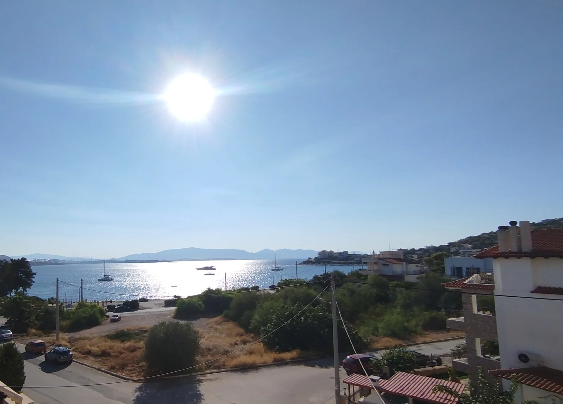 Stunning panoramic Aegean sea view from the balcony of a luxury apartment in Salamina, Greece.