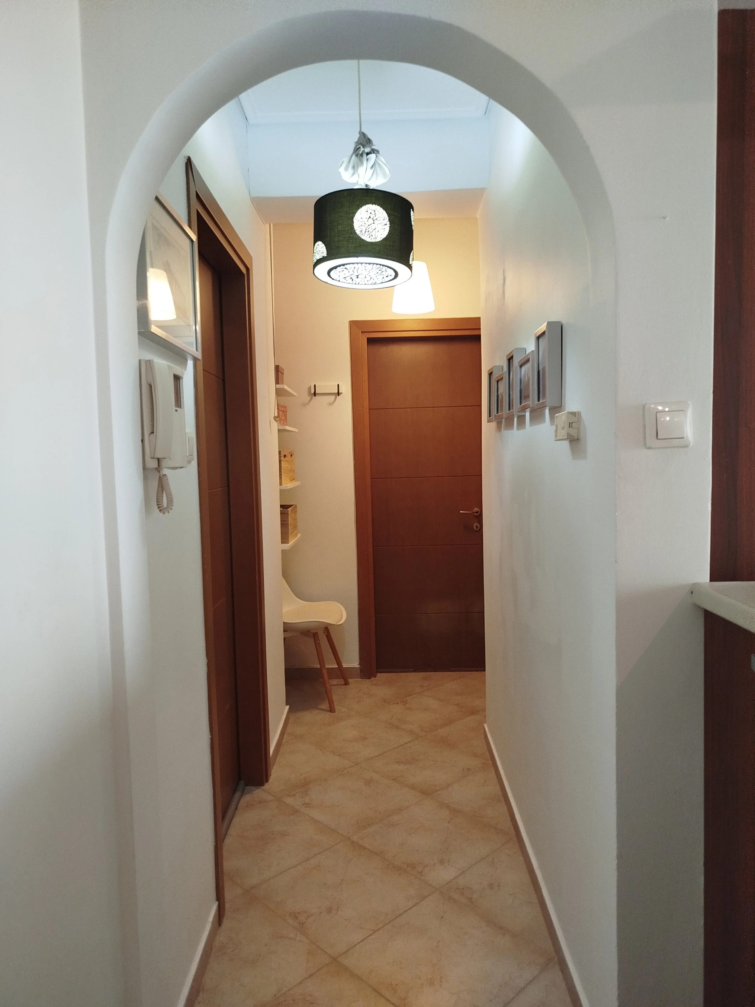 Elegant fully furnished living room with modern decor and sea view windows in Salamina apartment.