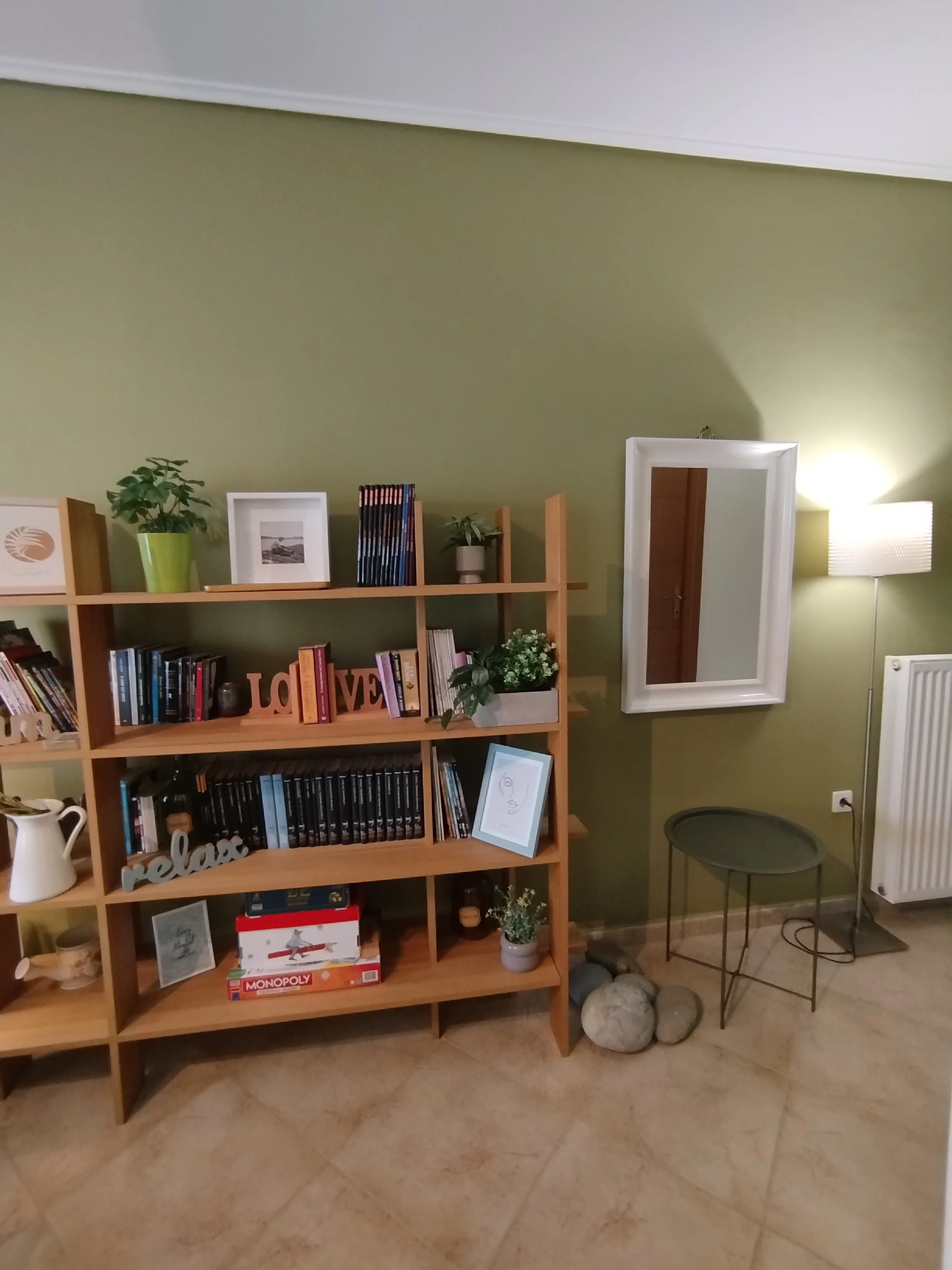 Elegant fully furnished living room with modern decor and sea view windows in Salamina apartment.