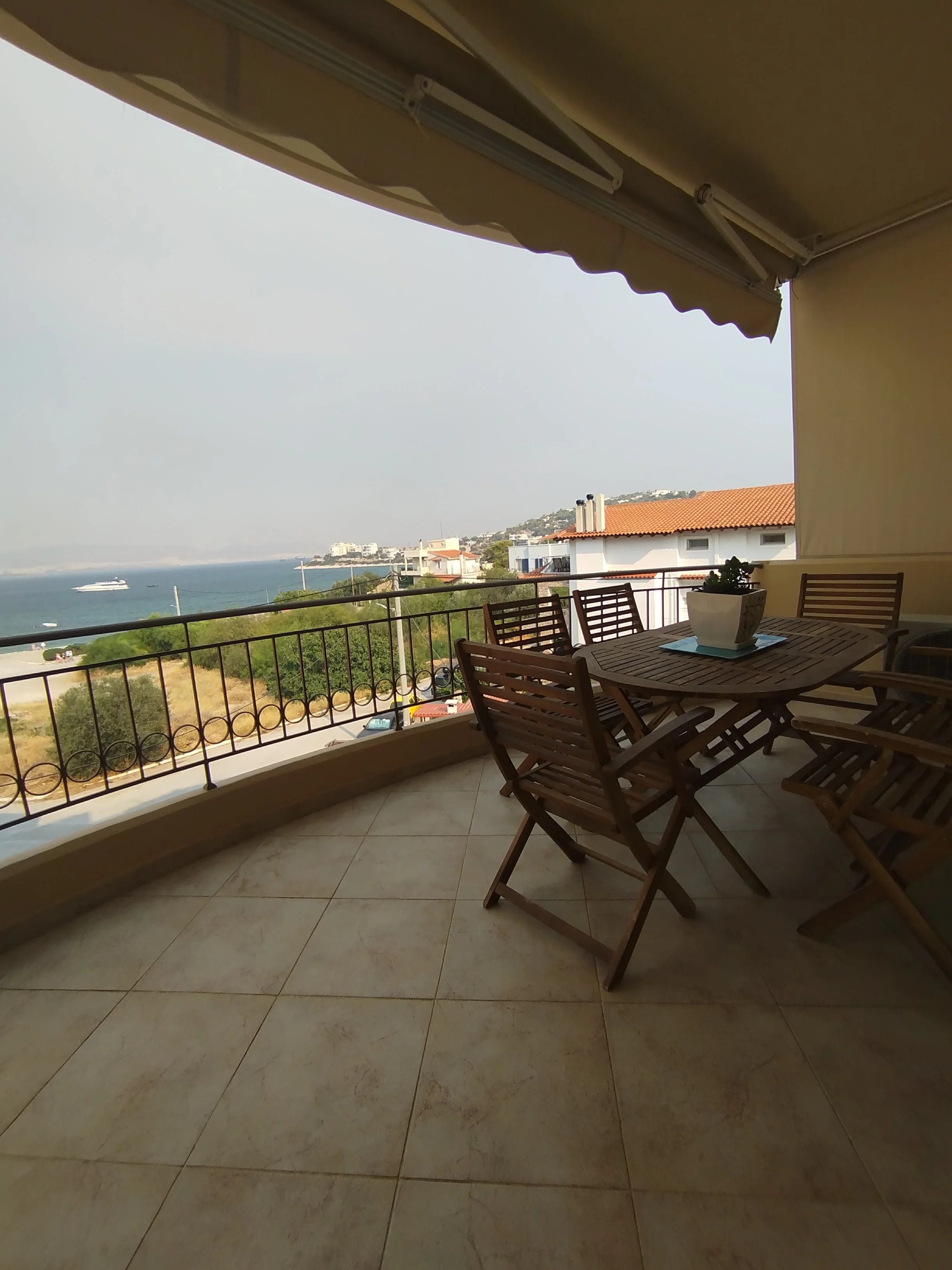 Stunning panoramic Aegean sea view from the balcony of a luxury apartment in Salamina, Greece.