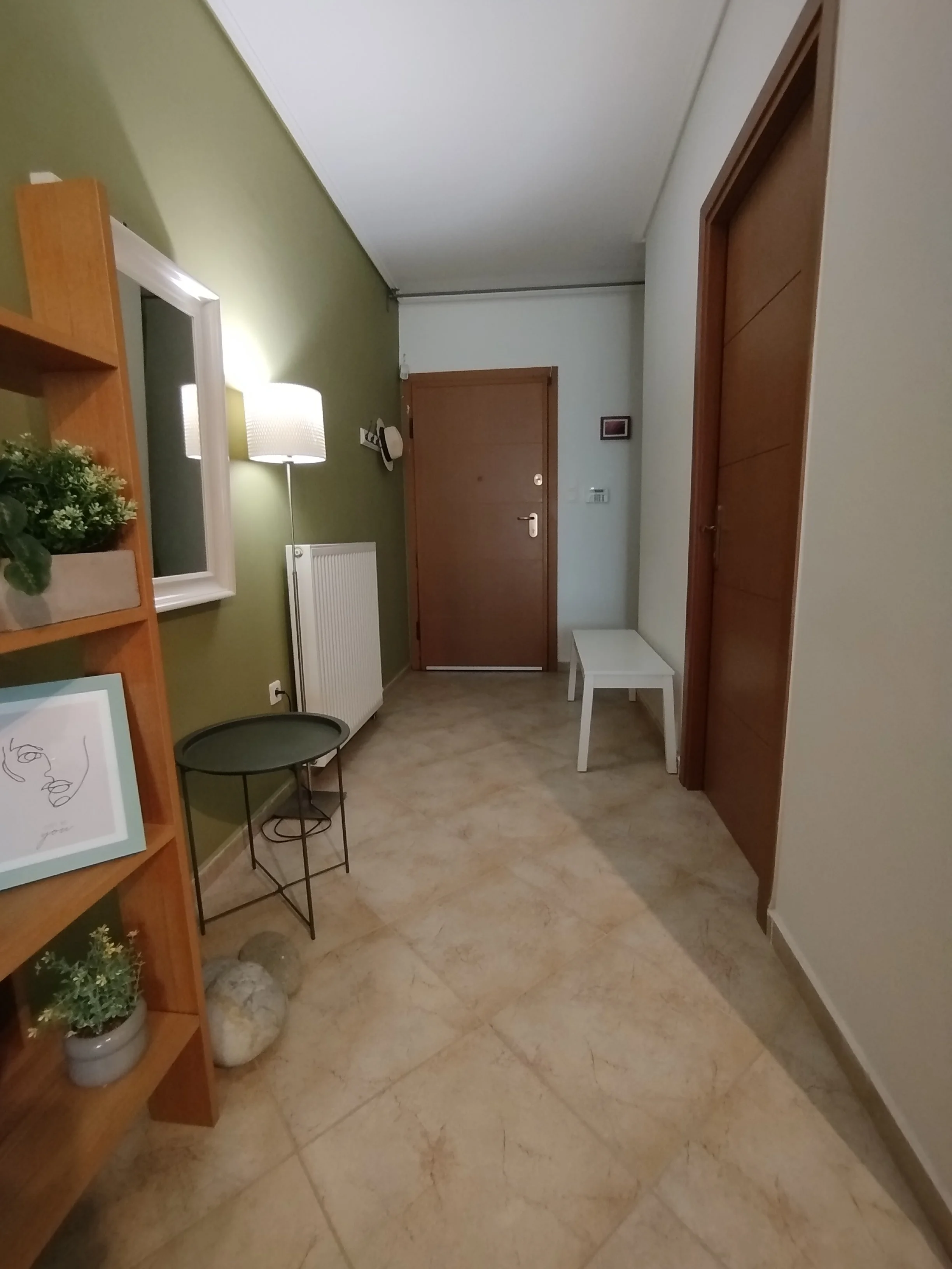 Elegant fully furnished living room with modern decor and sea view windows in Salamina apartment.