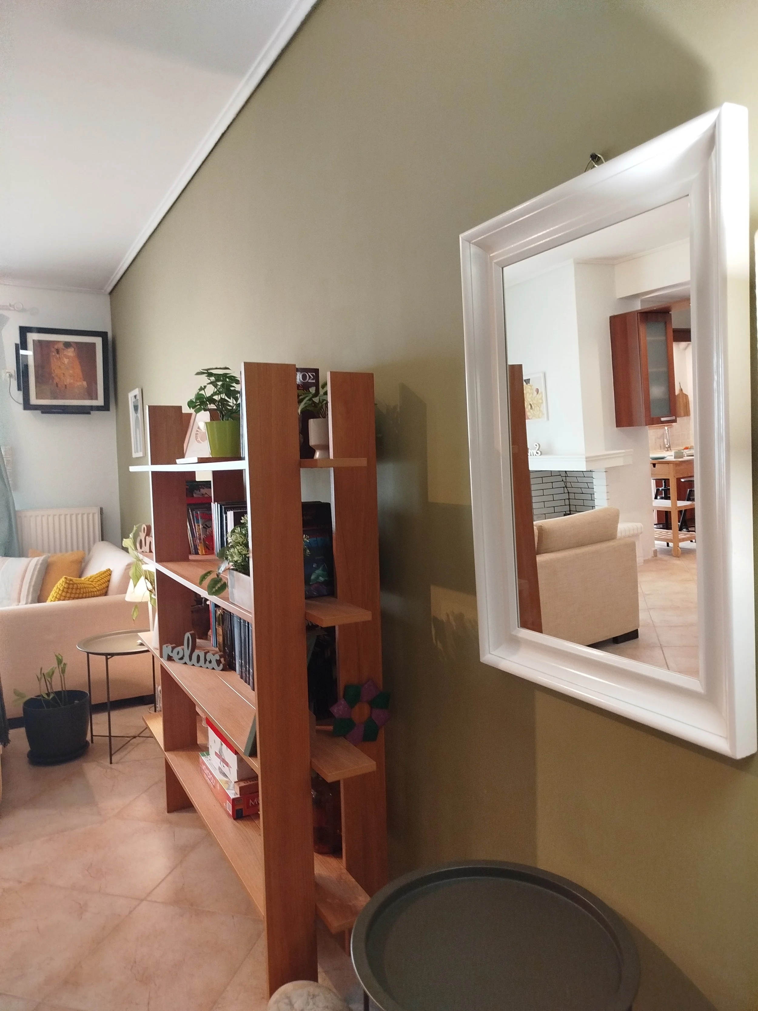Elegant fully furnished living room with modern decor and sea view windows in Salamina apartment.